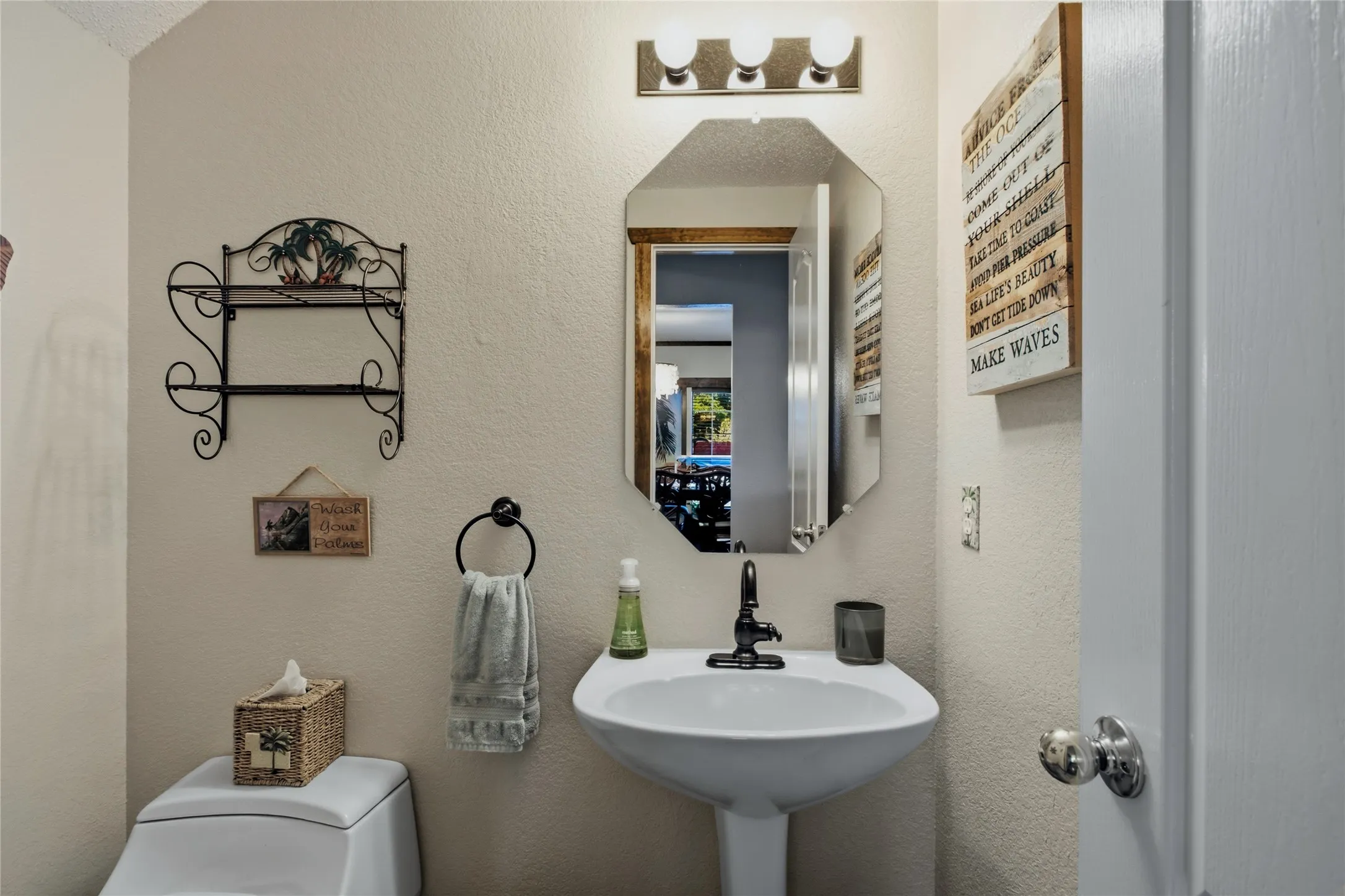 Half bath in the hallway from entry.