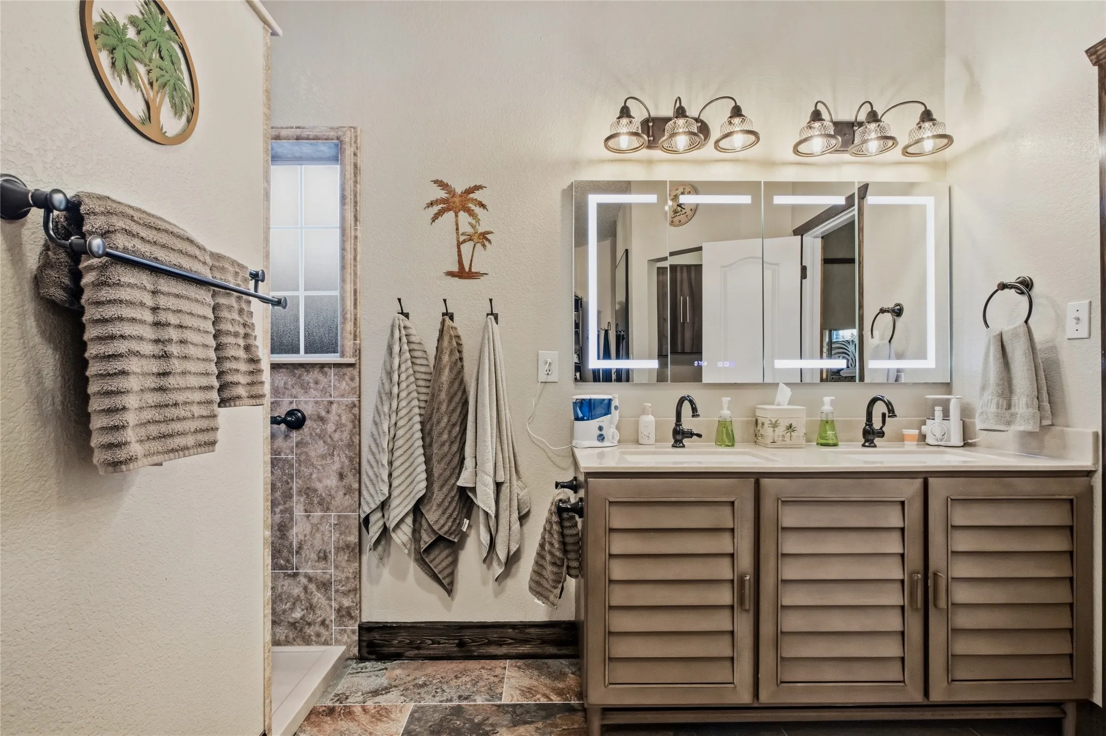 Dual sink and easy access to the shower in this renovated space.