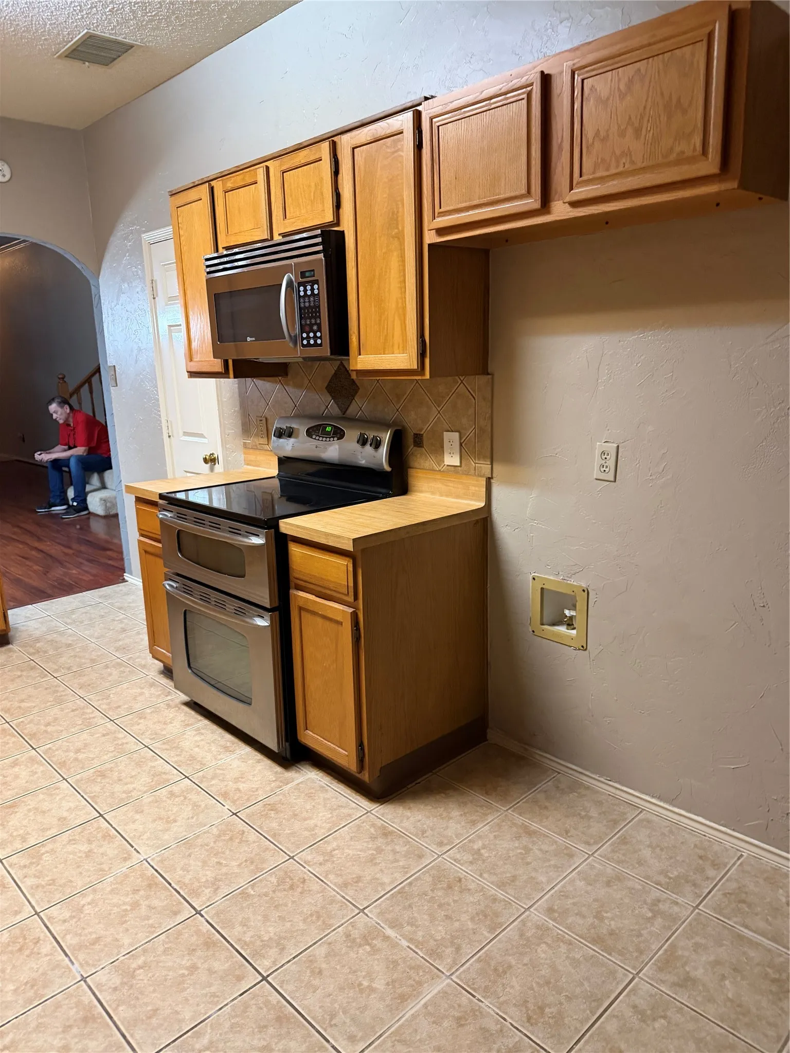 View of Cabinets, Range & Microwave