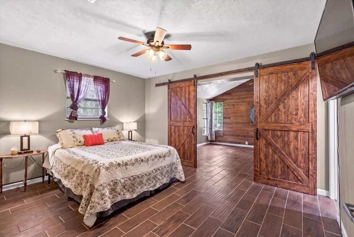 Primary bedroom with flex space with barn doors as you enter