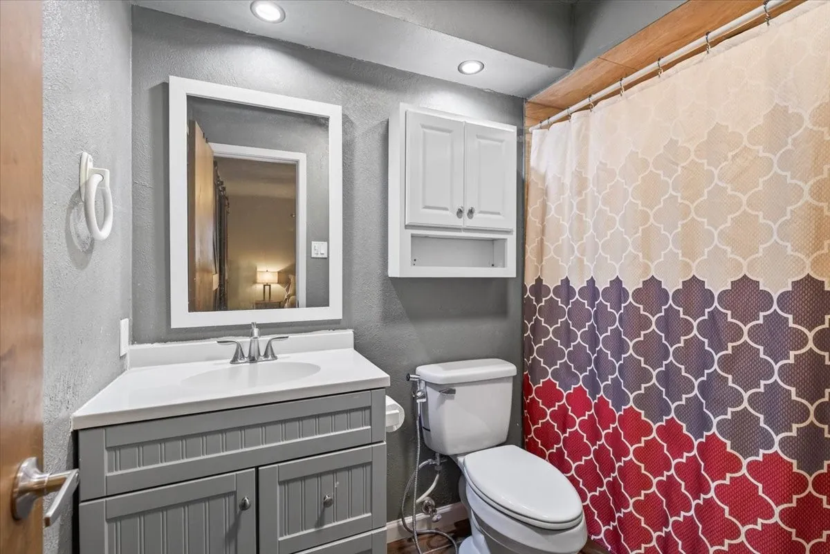 Primary bathroom with a nice updated shower and vanity