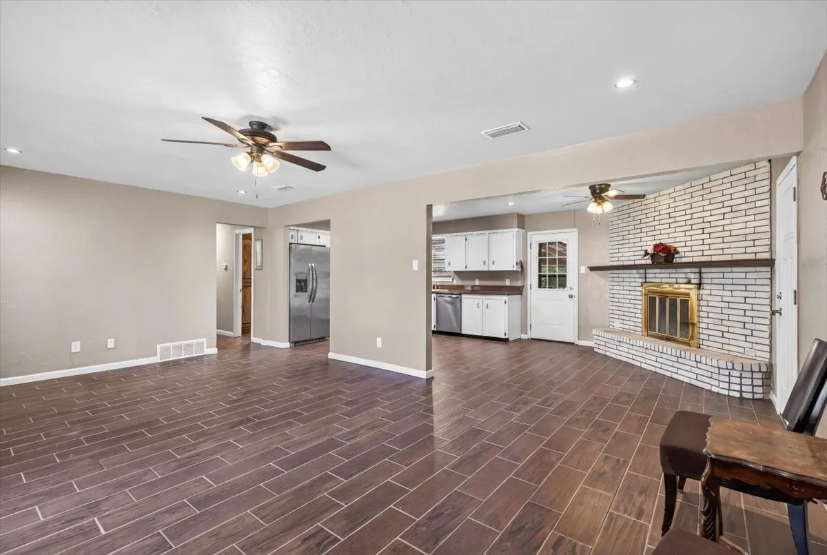 Living room highlighting the corner fireplace in the breakfast area