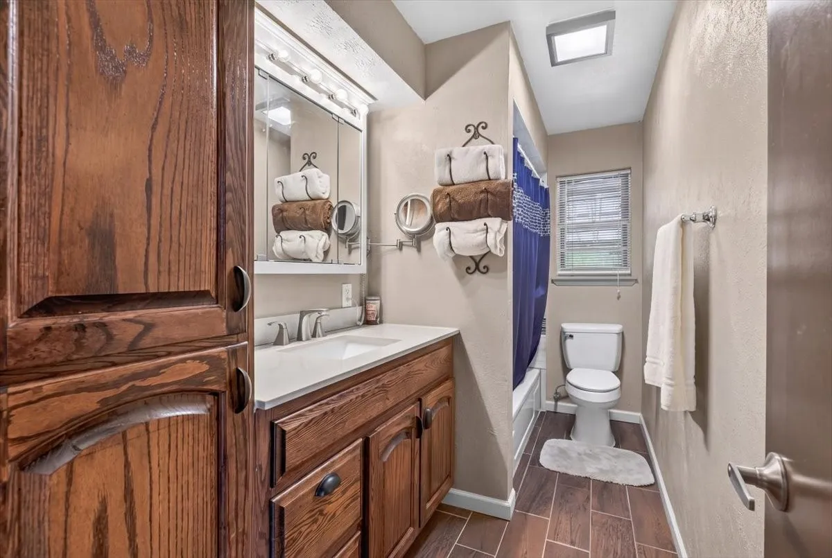 Hall bathroom with lots of cabinet space for storage.