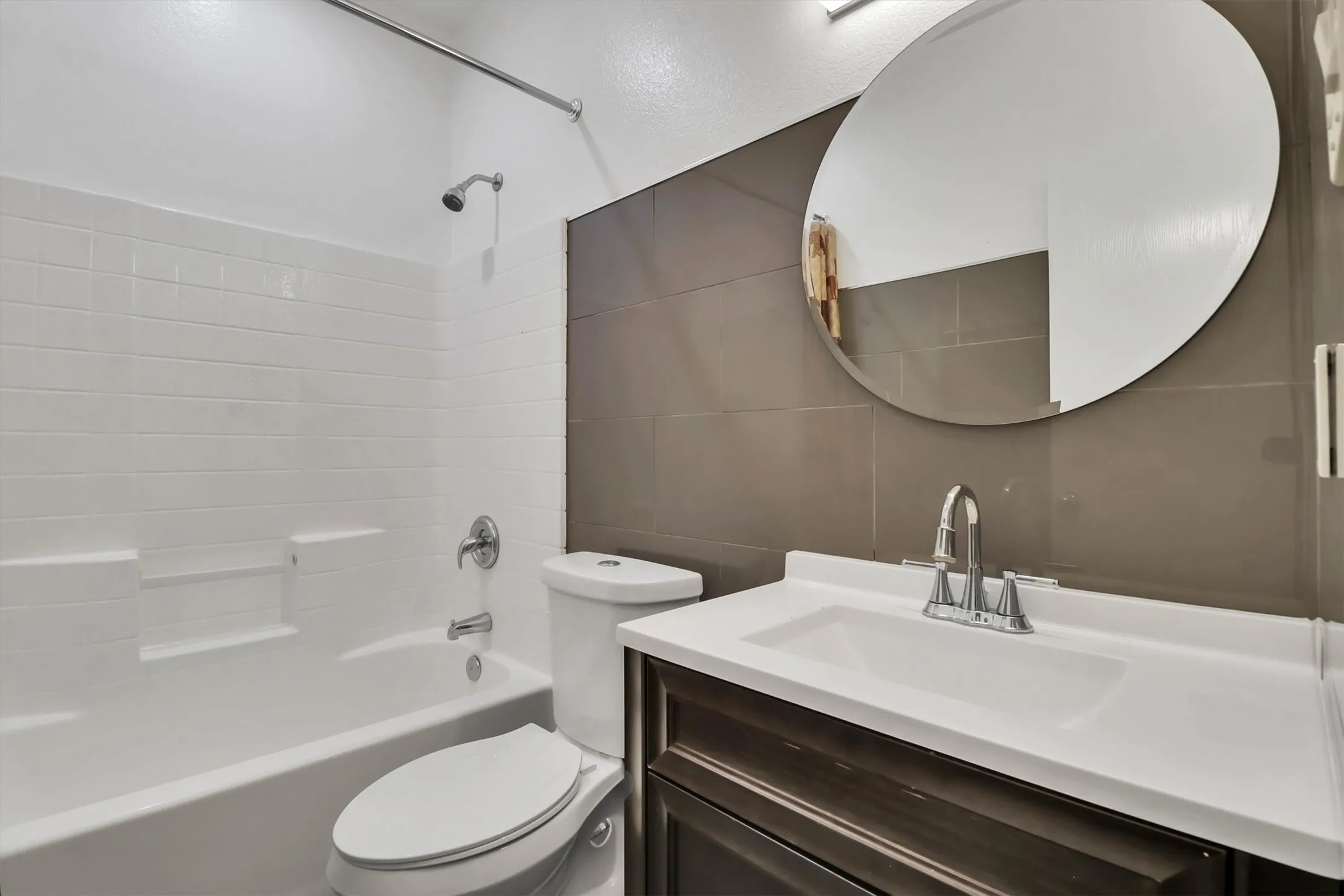 Guest bathroom, White subway tile bath surround with chrome fixtures