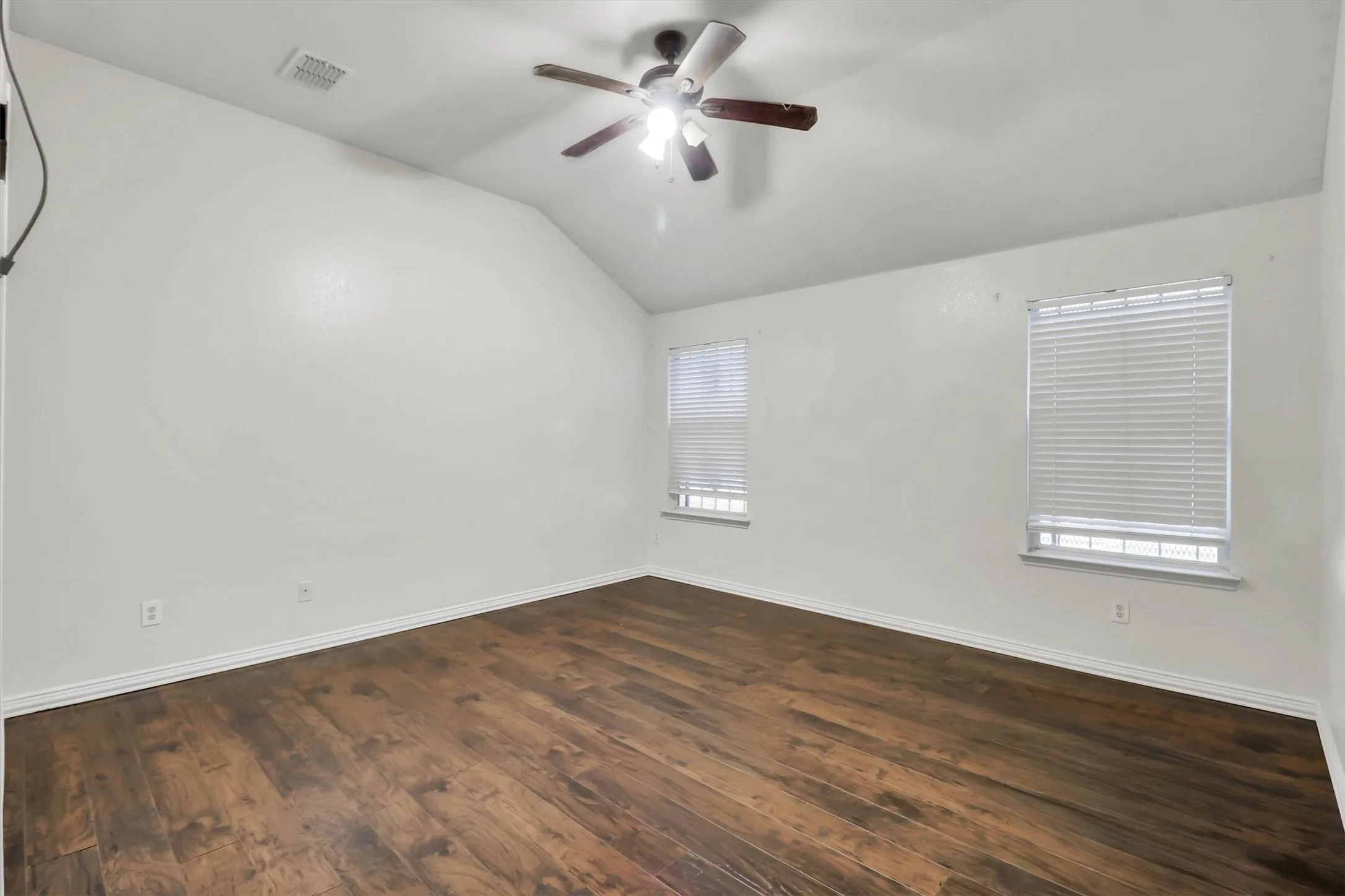 Vaulted ceiling with a ceiling fan