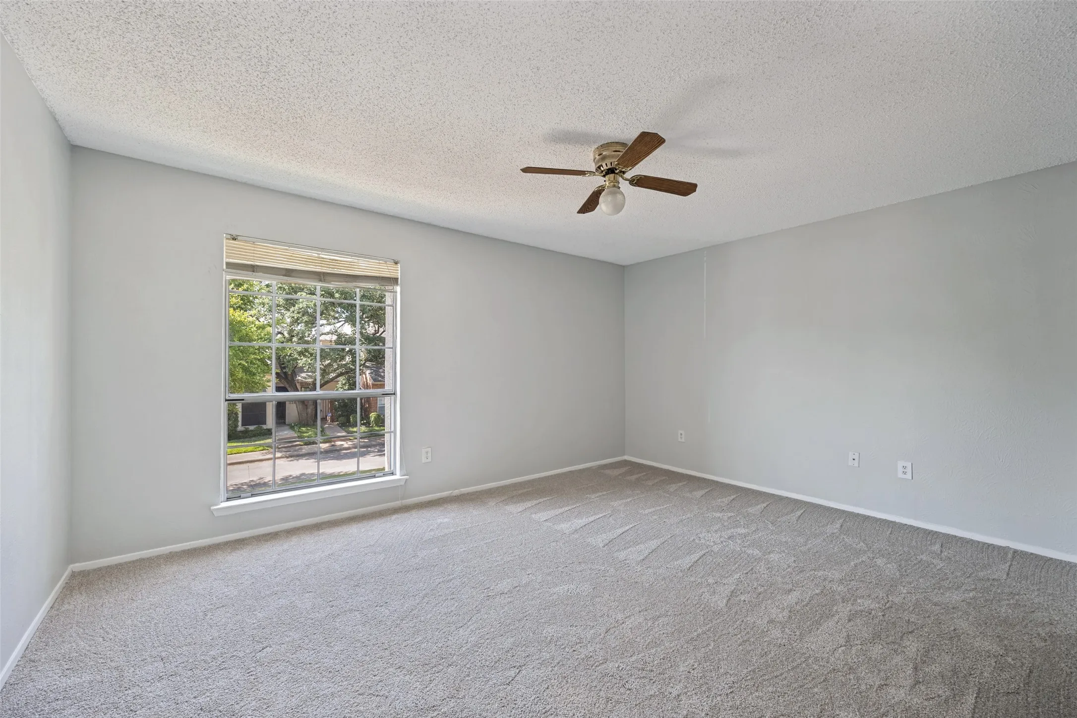 Bedroom #2 upstairs has tons of natural light and nature views