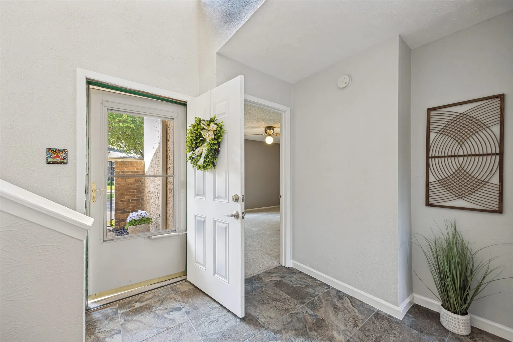 Updated floors complete this dramatic entrance with soaring ceilings