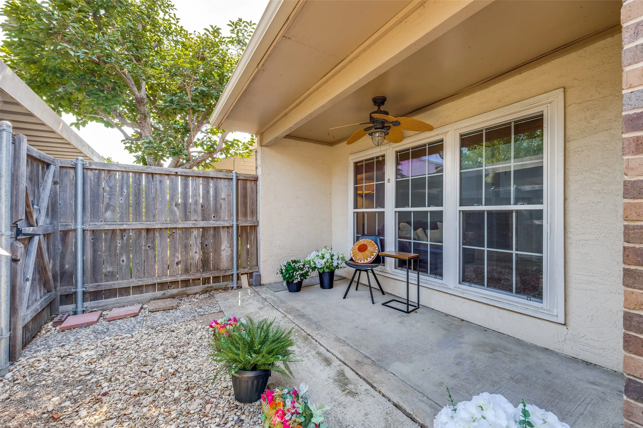 The private gated yard is perfect size for a small dog. Could plant grass or turf to keep it low maintenance.