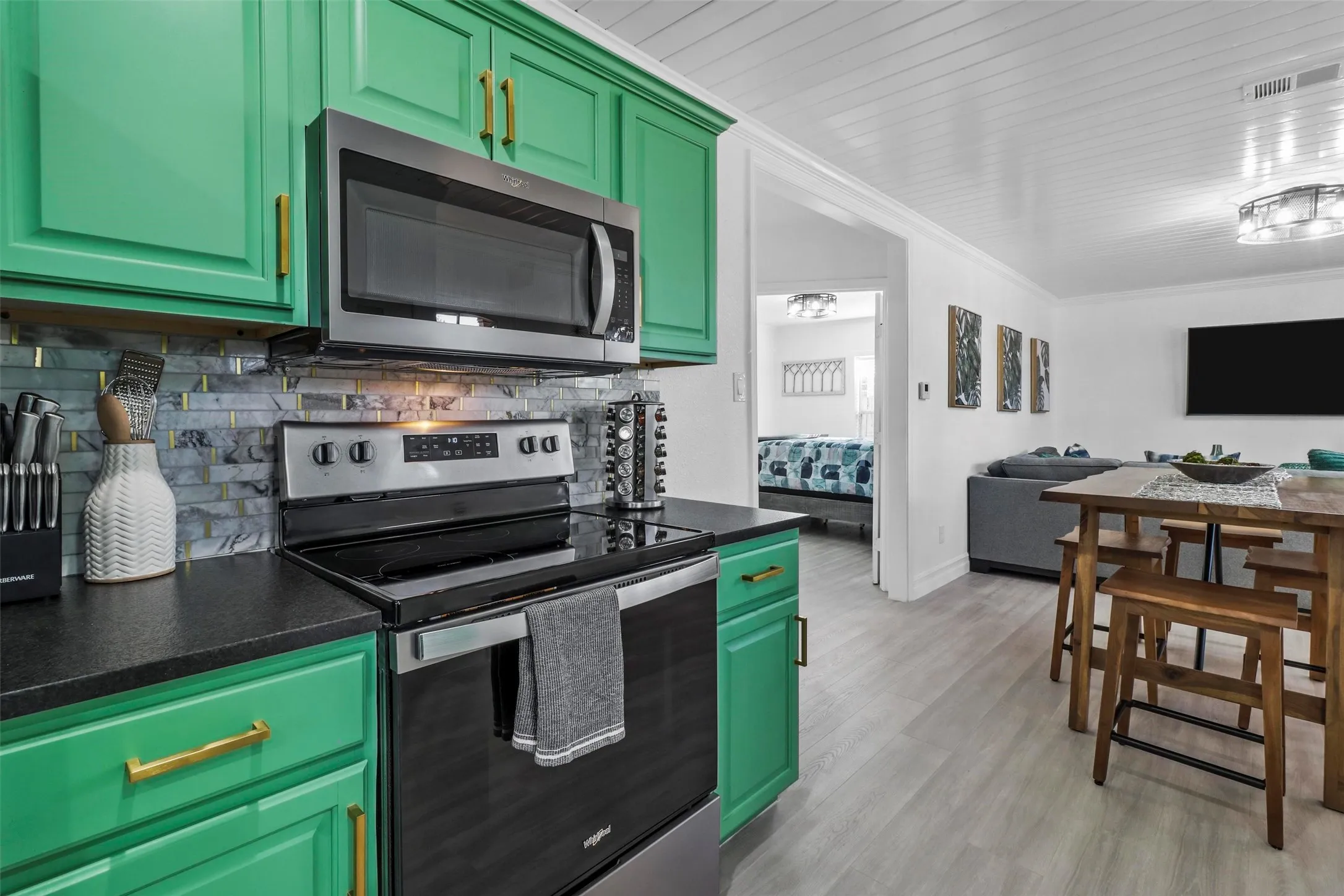 Large doorways, custom lighting and shiplap ceilings make this the cutest space.