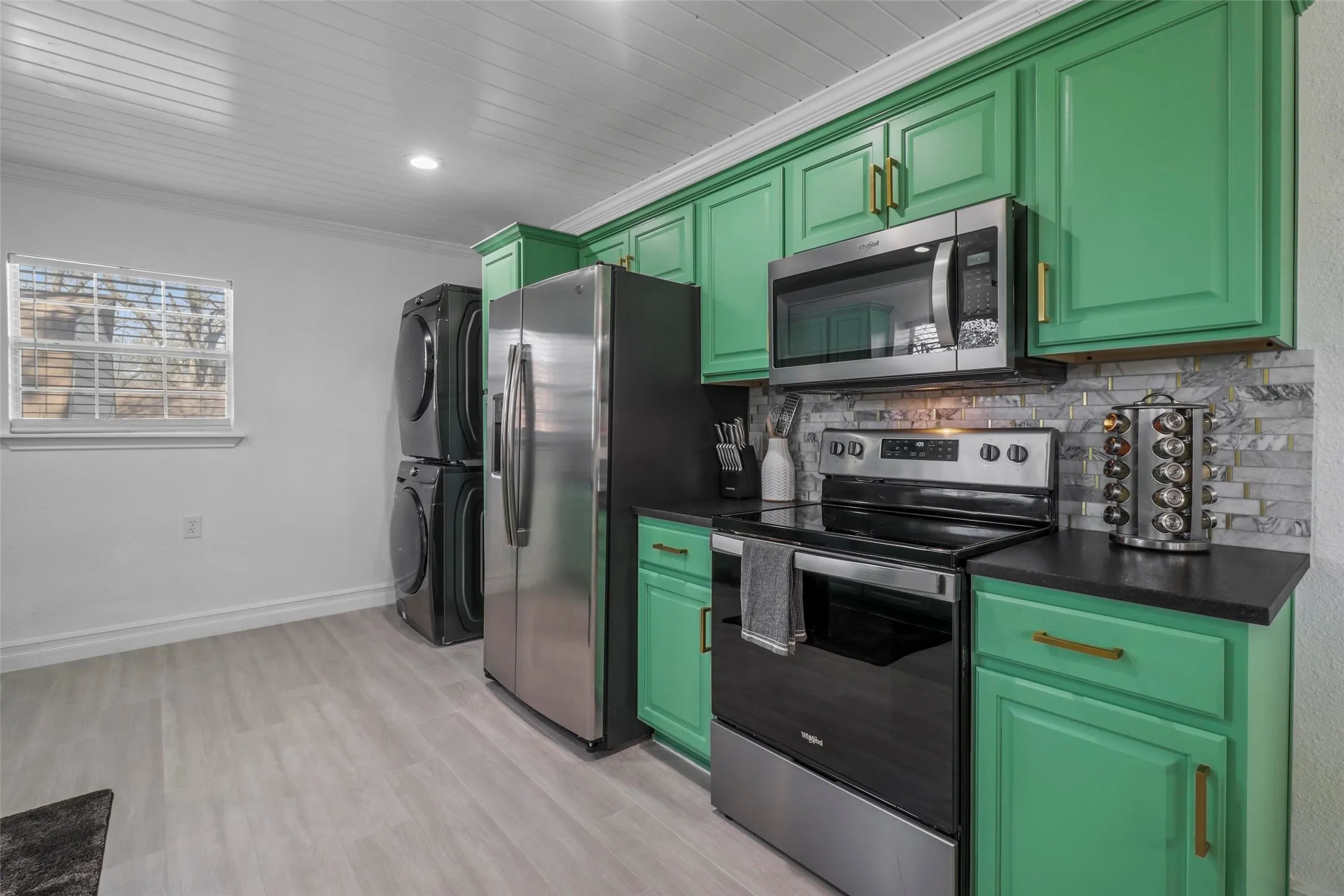Stackable washer and dryer in kitchen