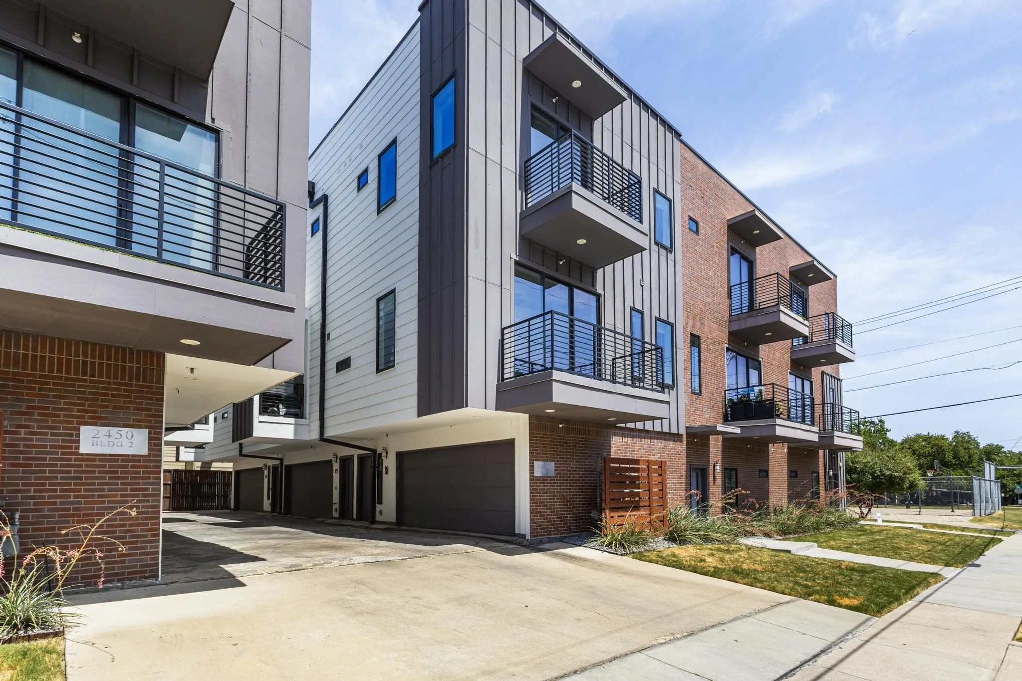 Modern facade featuring brick, vertical siding, and horizontal paneling