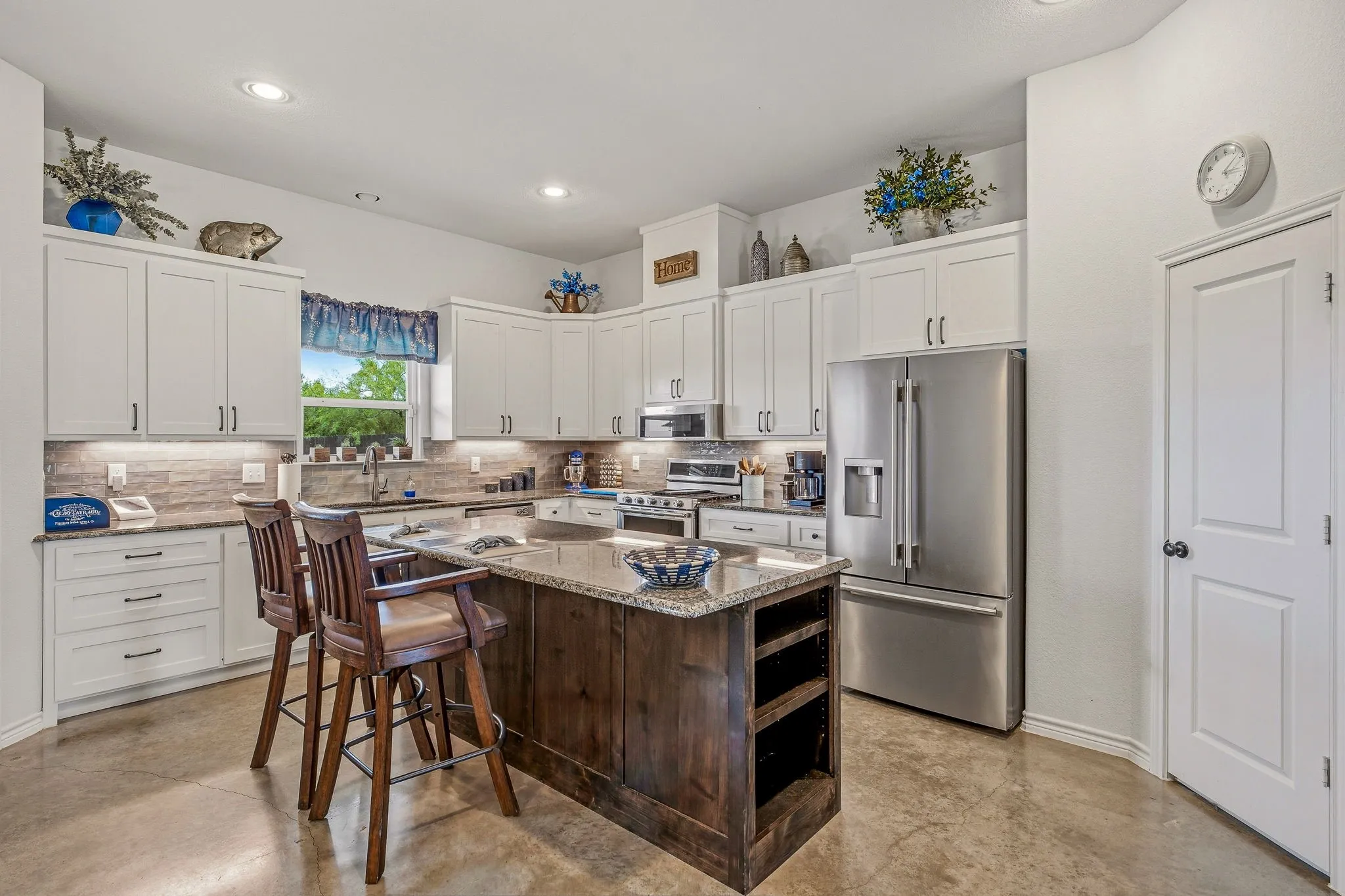 Kitchen with lovely granite and subway backsplash.