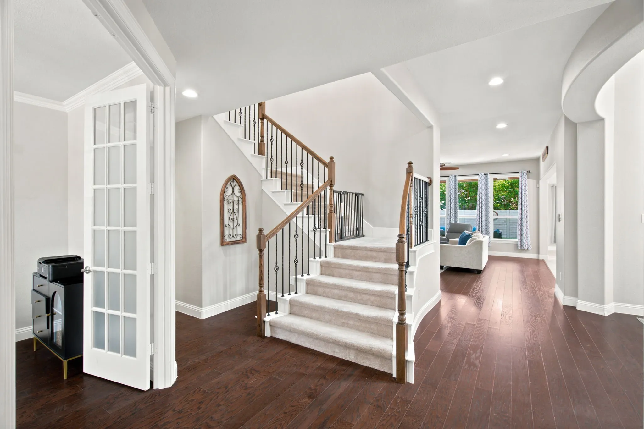 Grand entrance space and rich wood flooring