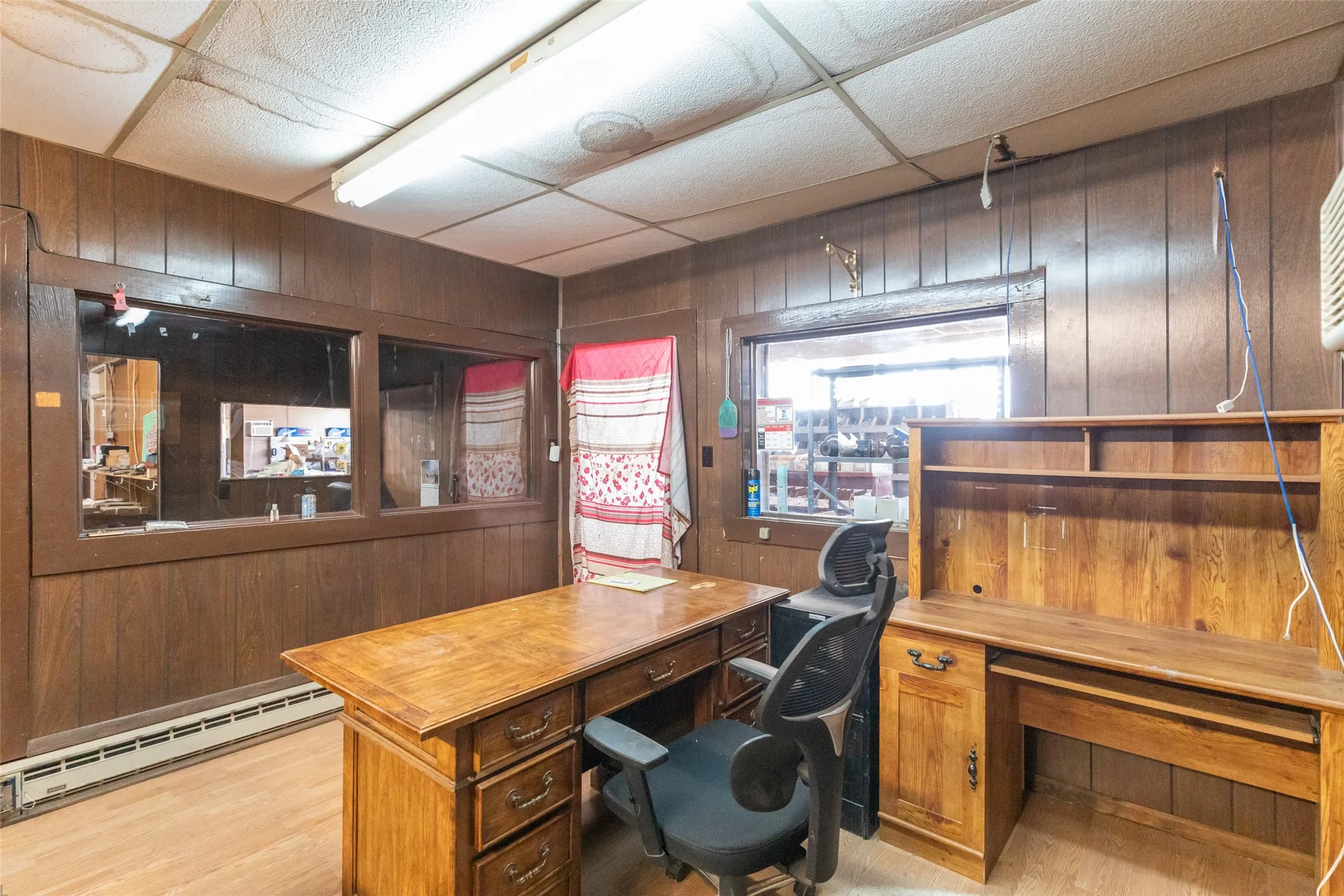 Wood-paneled walls with integrated window panels