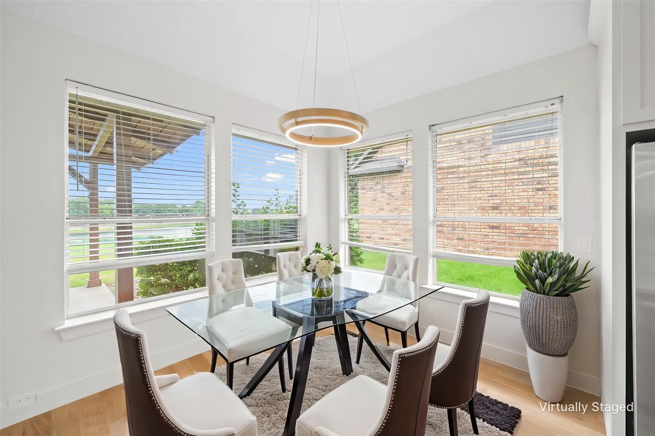 High ceilings with recessed lighting, wood-finish flooring, and multiple windows with blinds