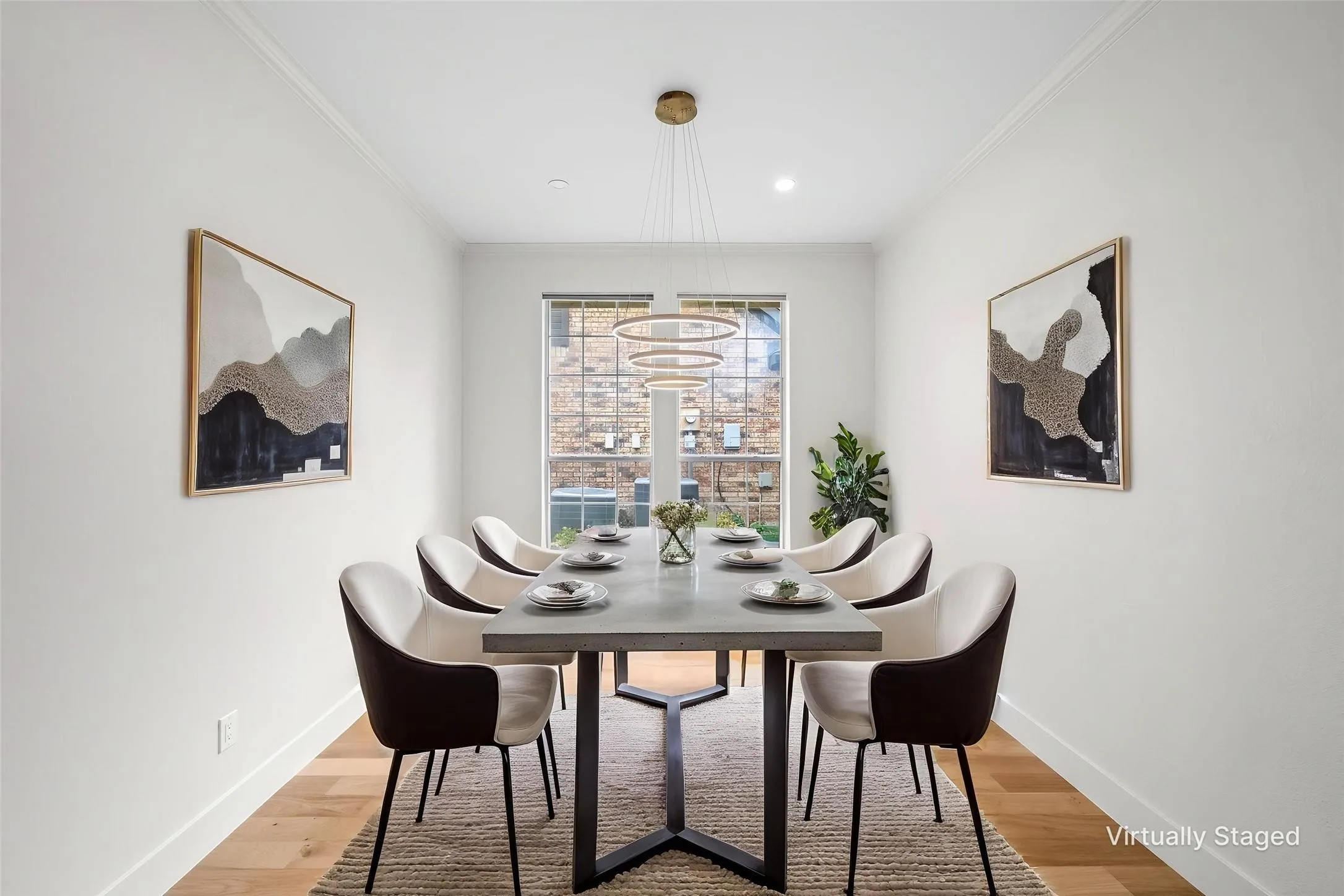 Recessed lighting, crown molding, wood-finish flooring, and a contemporary chandelier