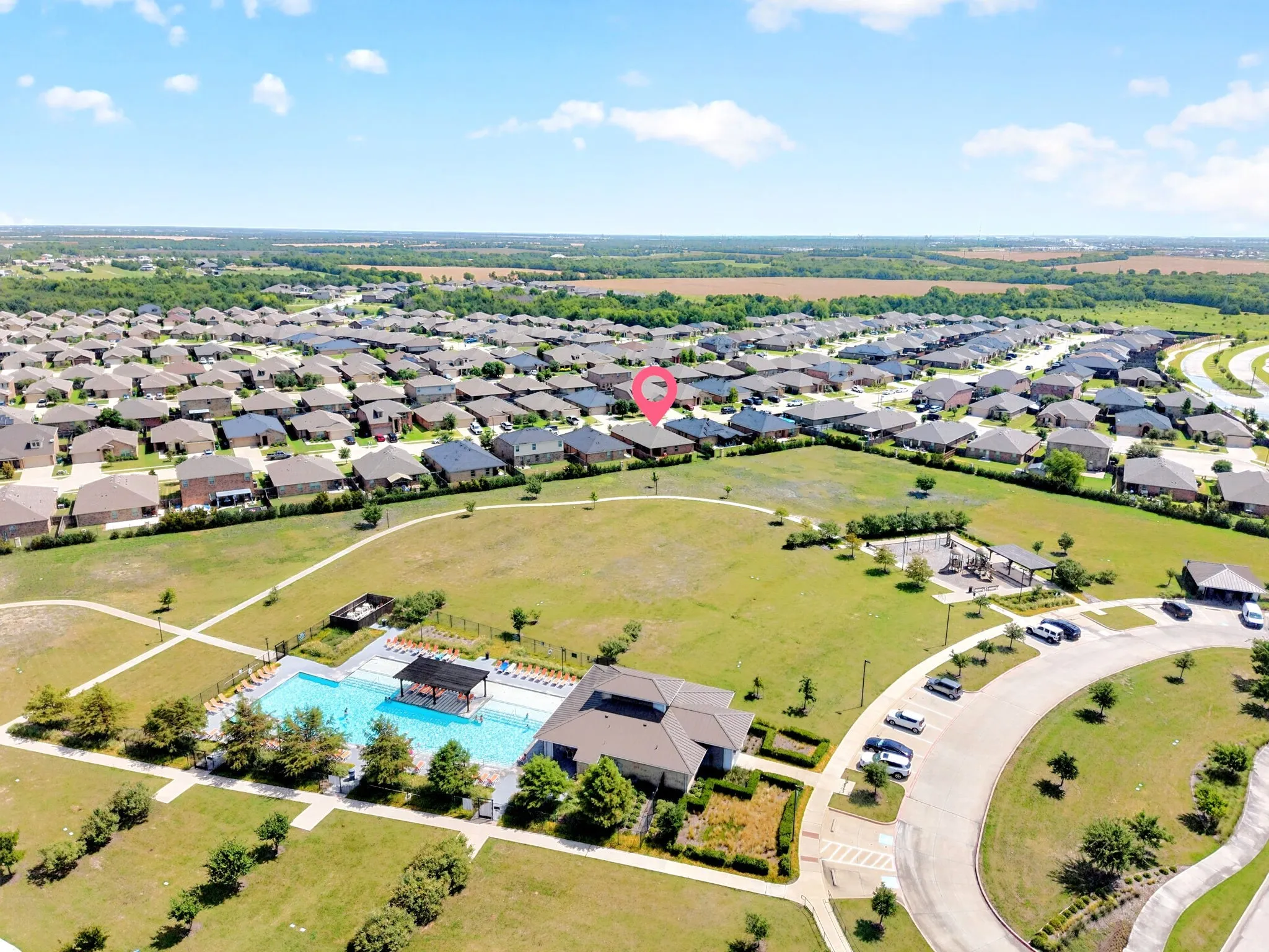 Community amenities include a swimming pool, covered lounge area, dedicated playground, and winding pathways