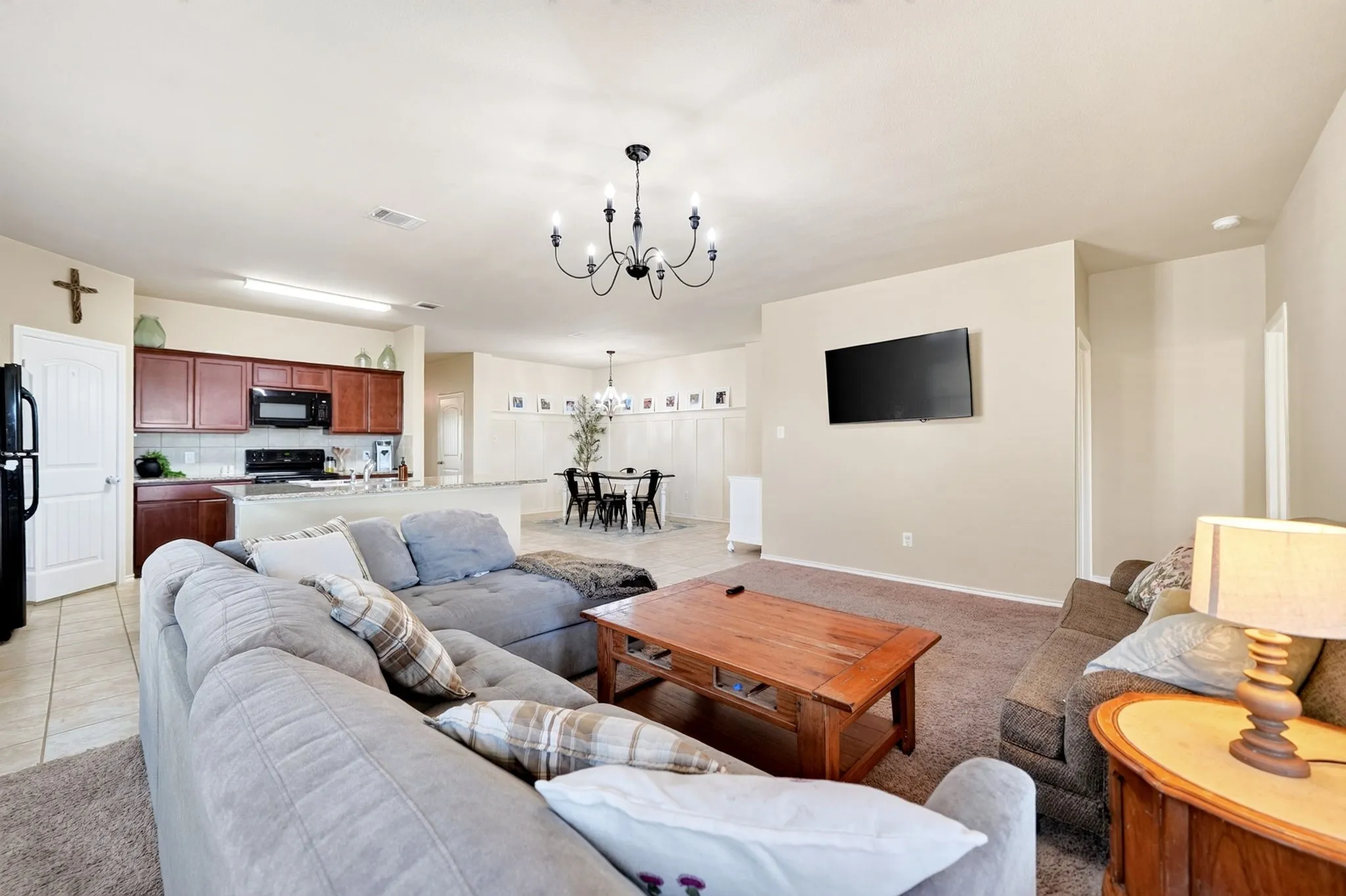 Open-concept living space featuring a living room, dining area, and kitchen