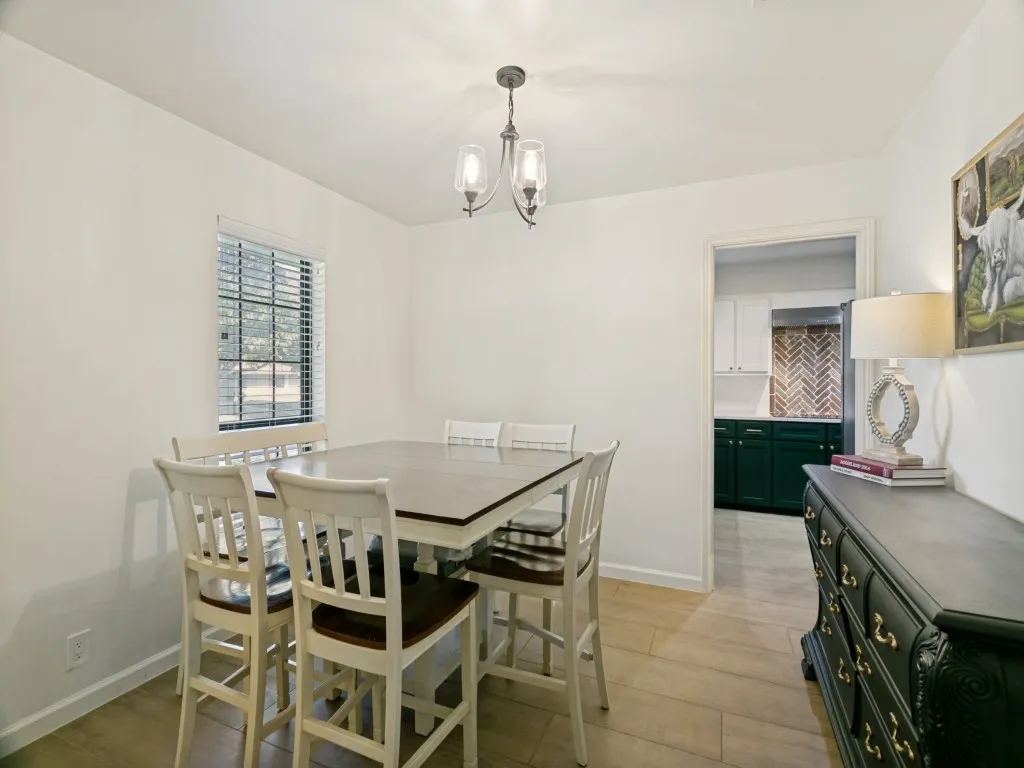 The dining area sits just off the entry and kitchen for easy everyday living and entertaining.