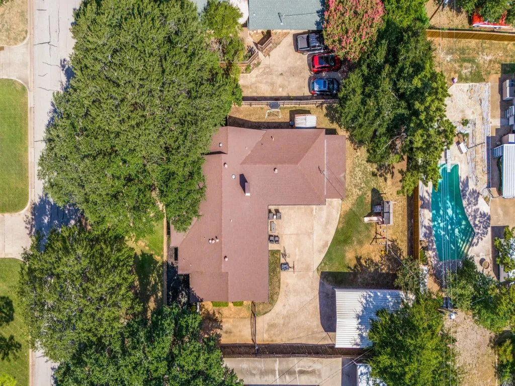From above, the oversized lot really stands out, with mature shade trees, a spacious backyard, extended driveway and plenty of room to enjoy the outdoors.