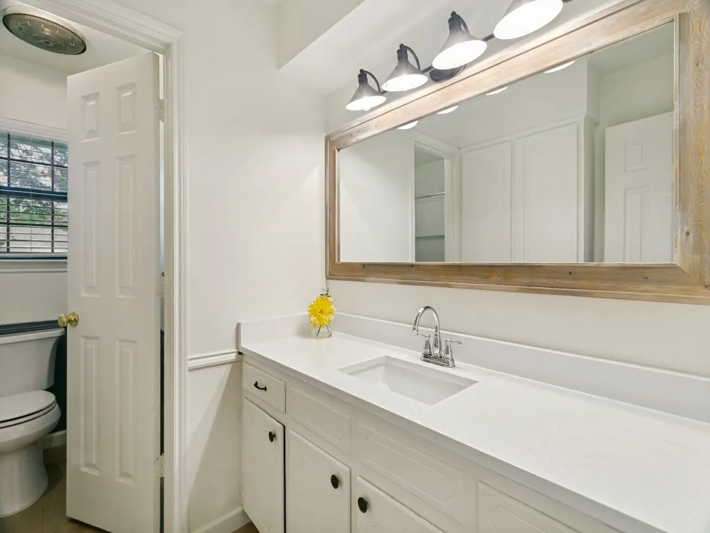 Full secondary bath with generous counter space and updated finishes.