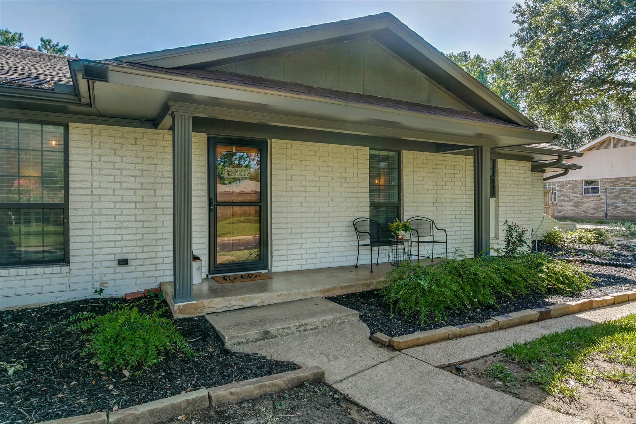 A closer look at the welcoming covered front entry.