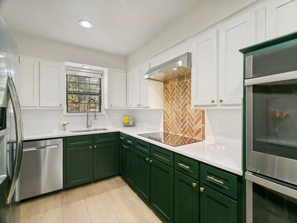 Double ovens, ceramic cooktop and generous cabinetry make this kitchen as functional as it is attractive.