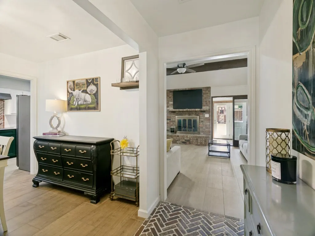 An open flow from the entry connects the dining, kitchen and main living spaces.