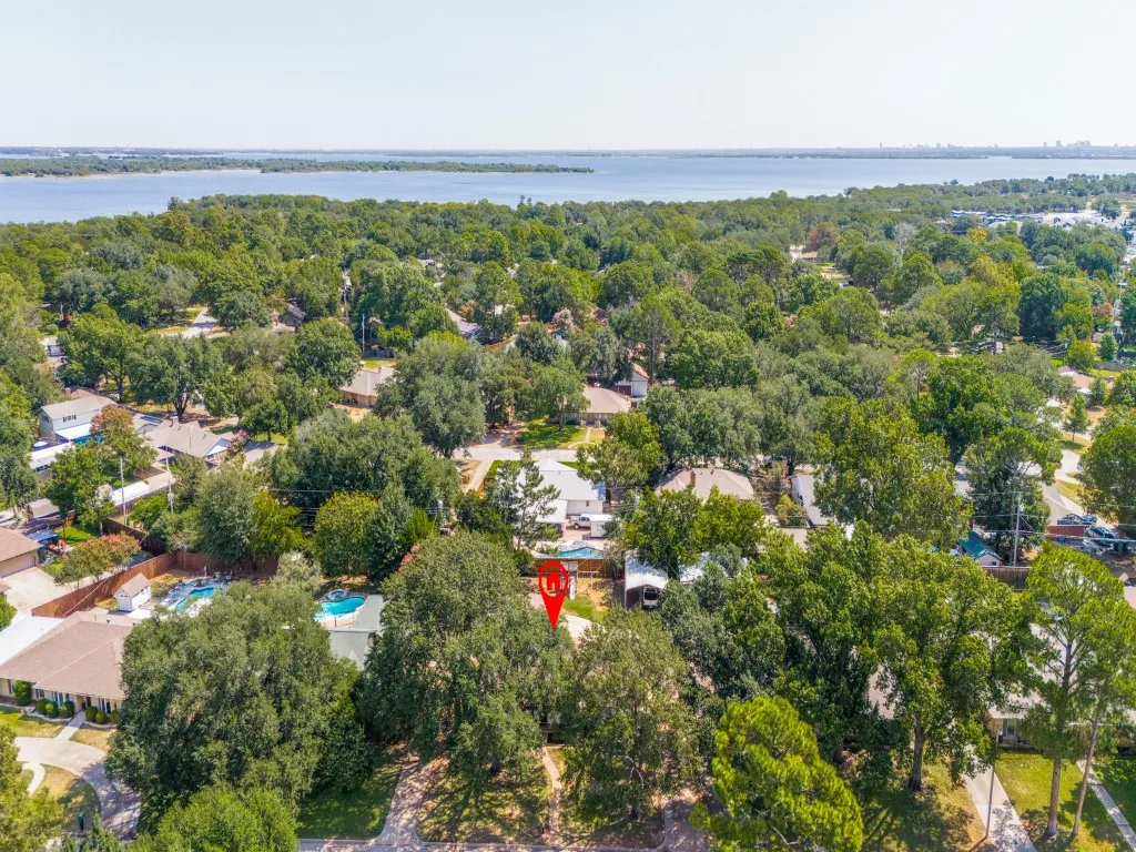 Tucked beneath a canopy of trees, 421 Frankie Lane offers an established neighborhood setting just minutes from Lewisville Lake, Lake Park and Lake Park Golf Course.