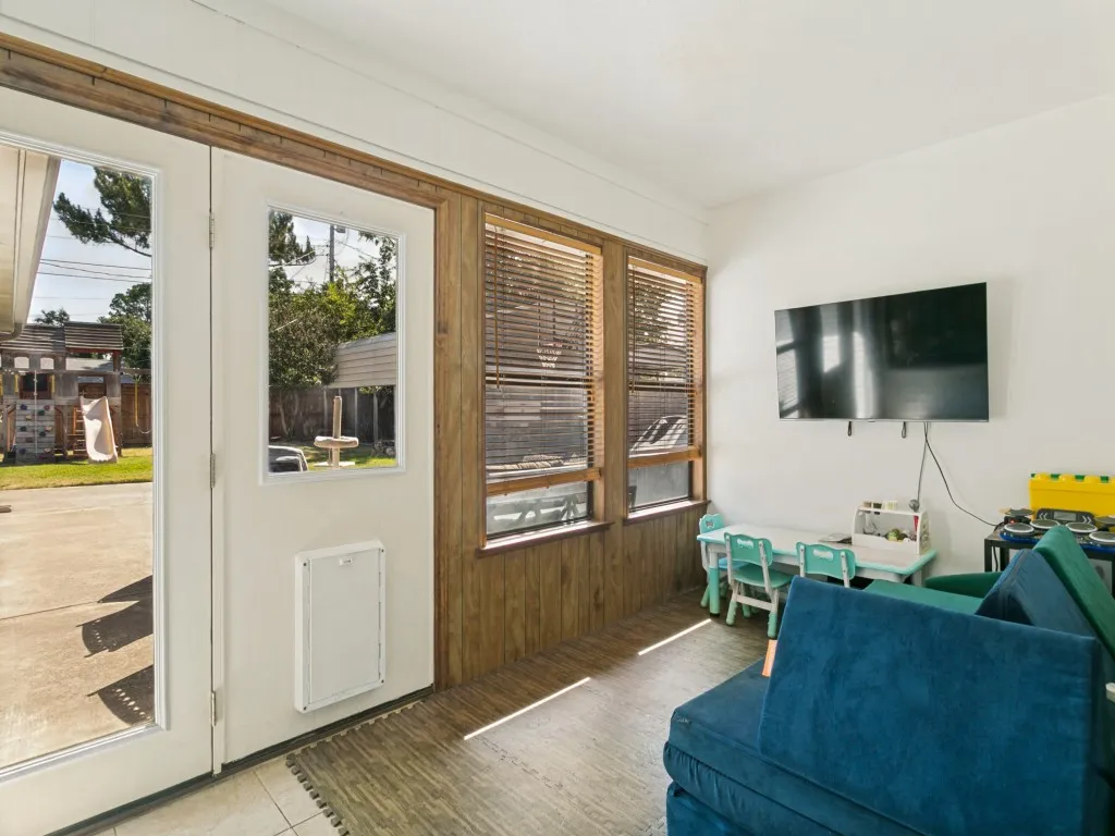 Filled with natural light and backyard views, this versatile space could serve as a sitting area, playroom, hobby space or more.