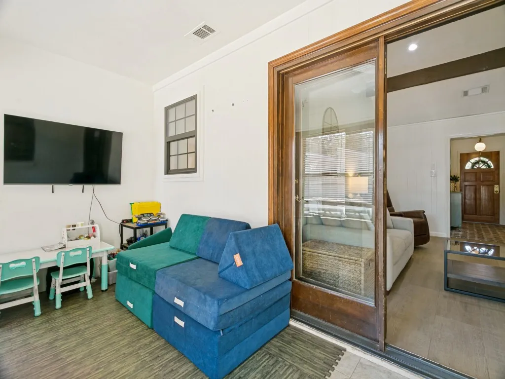 Just beyond the kitchen, this flexible bonus space offers easy access to both the backyard and main living areas.