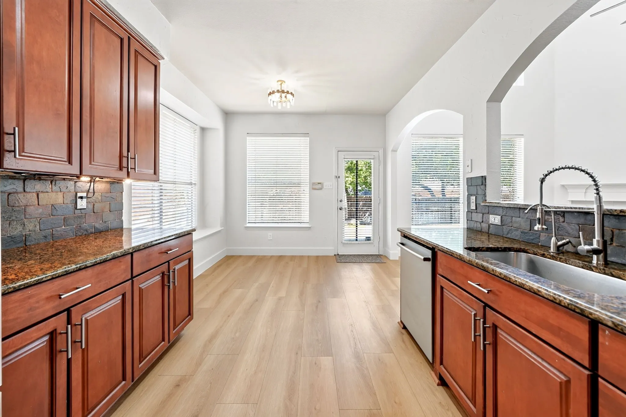 Granite counters and stainless appliances. Fridge will convey.