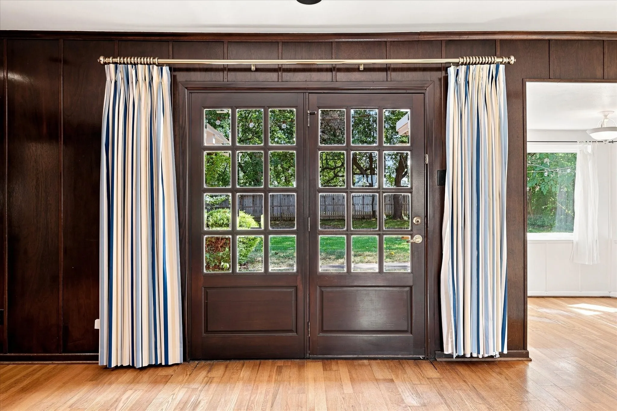 These doors right off the living room welcome you to a huge backyard.