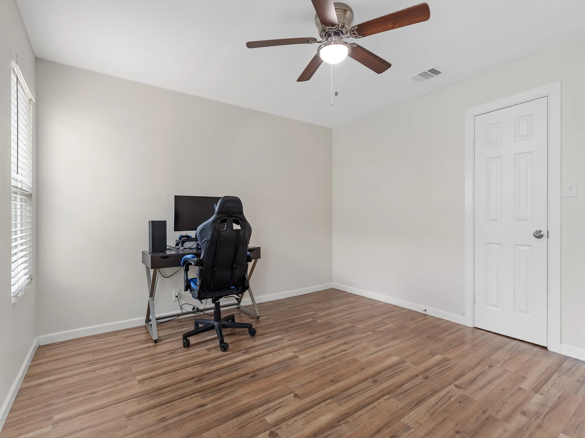 Bedroom #2 offers a generous space for a full bedroom suite