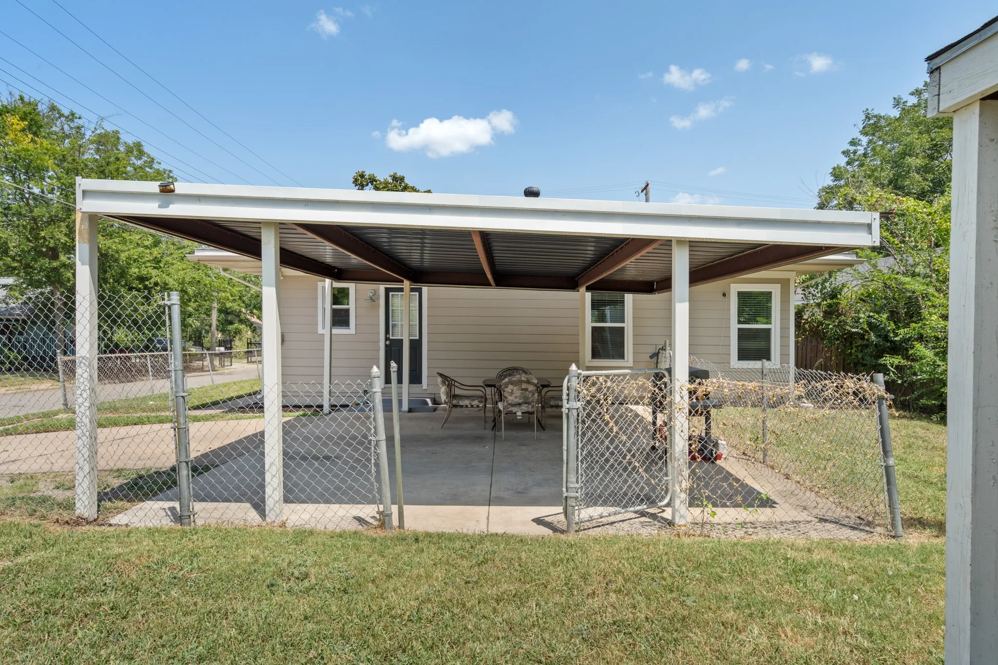 Fully fenced yard and covered outdoor space provide added privacy and versatility, with plenty of room to relax, entertain or enjoy the outdoors.