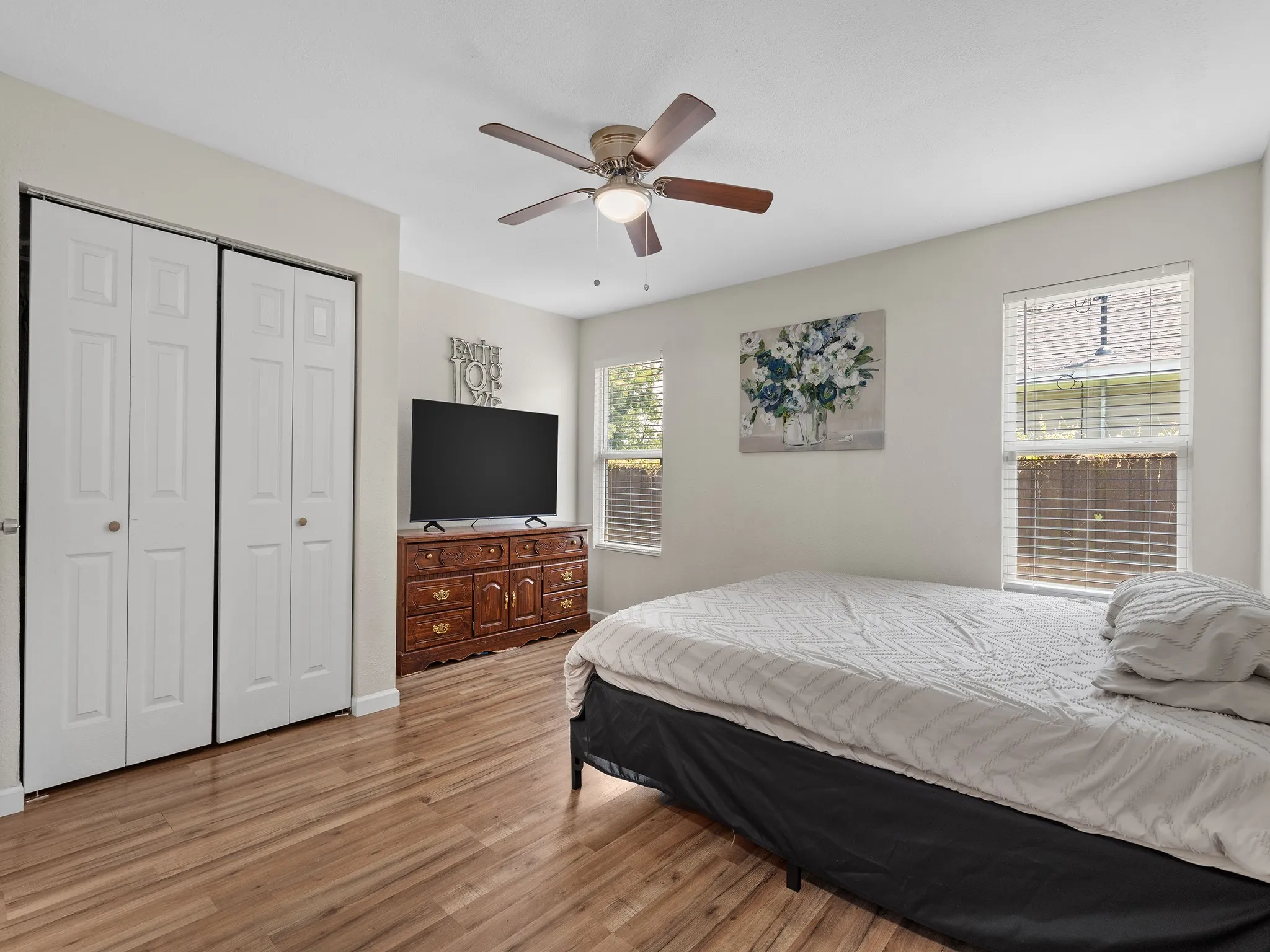 Primary Suite with moderately sized Reach-in closet and en suite