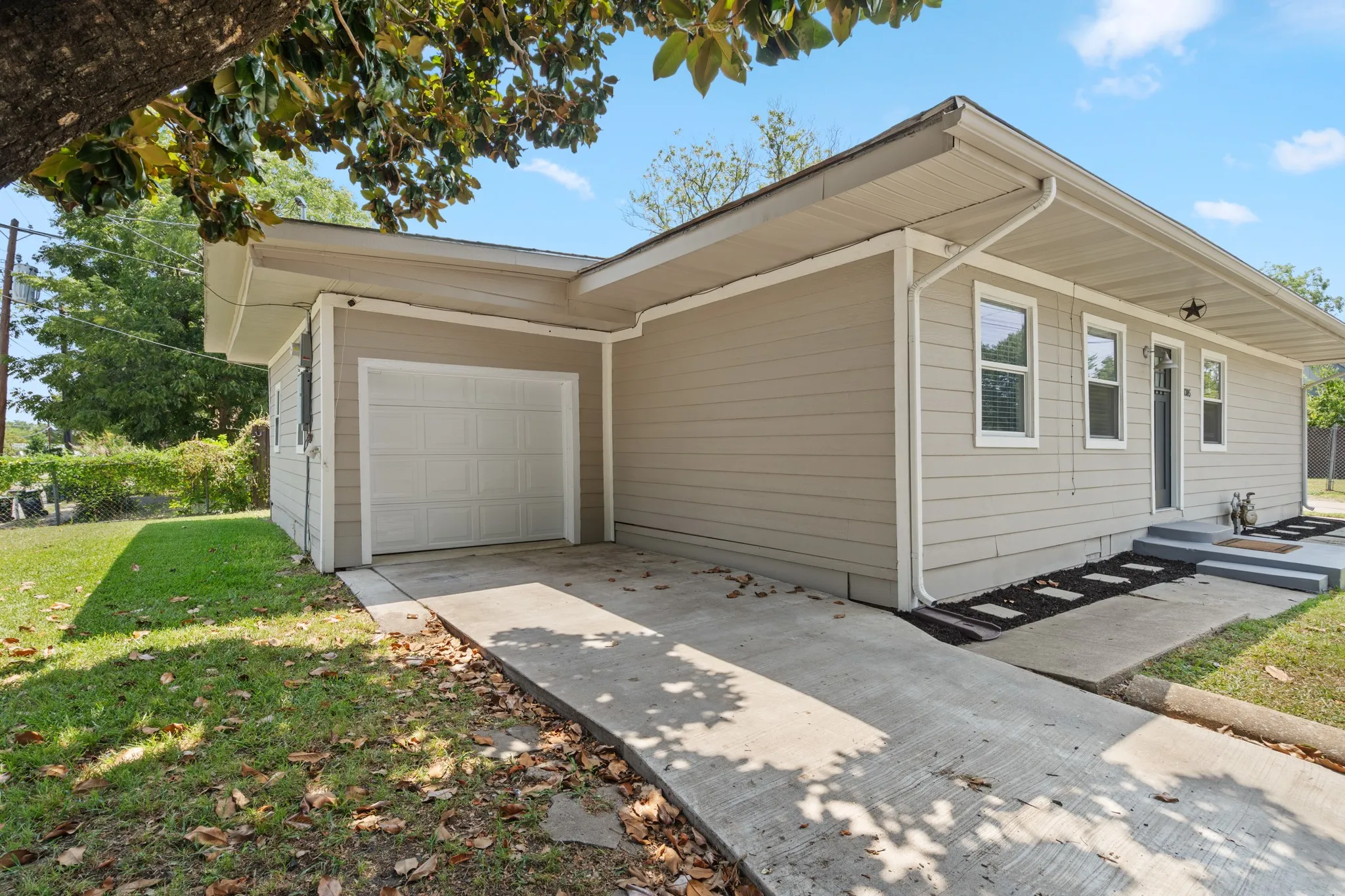 Attached one-car garage provides secure parking, storage or workshop potential.