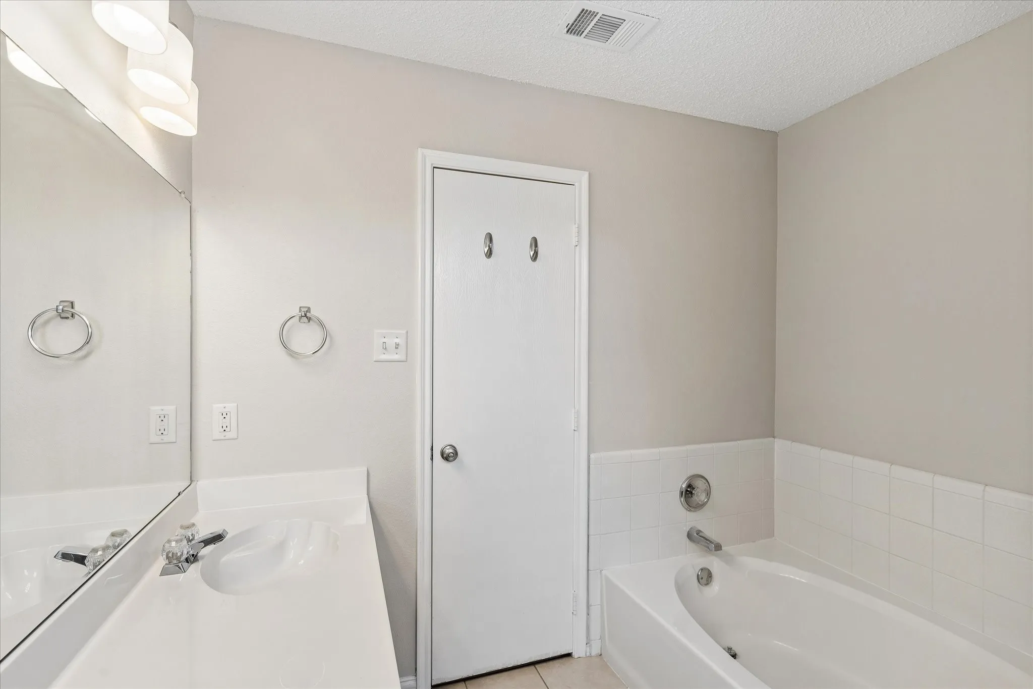 Features a tub and separate shower