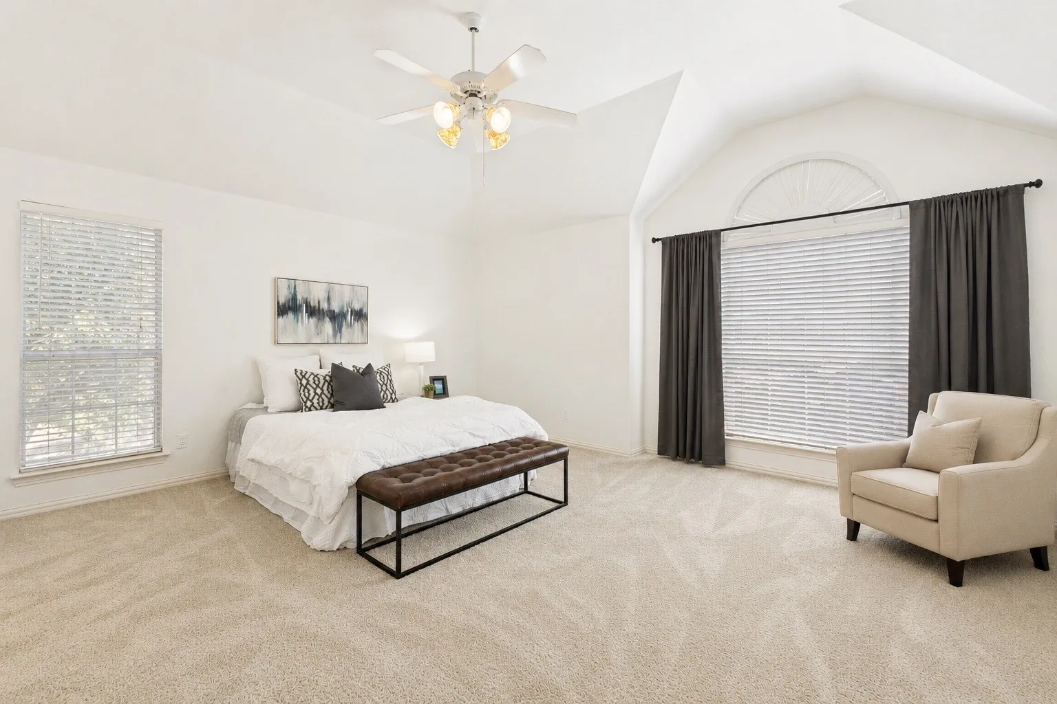 Large Primary bedroom with ensuite bath and dual closets.