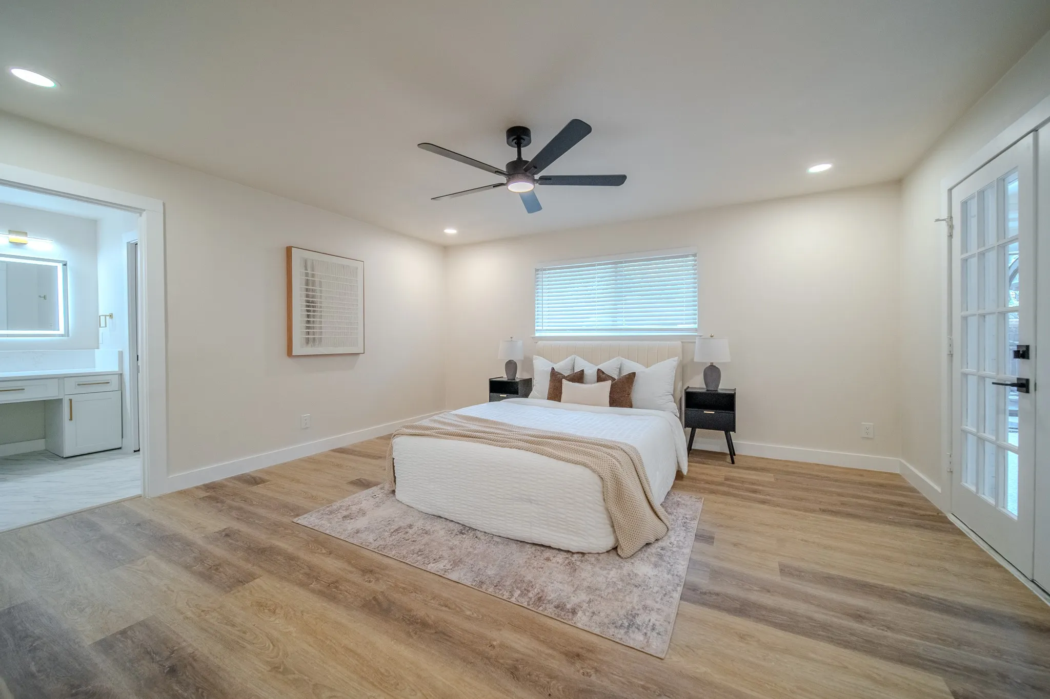 Wood-finish flooring, recessed lighting, and a ceiling fan with light fixture