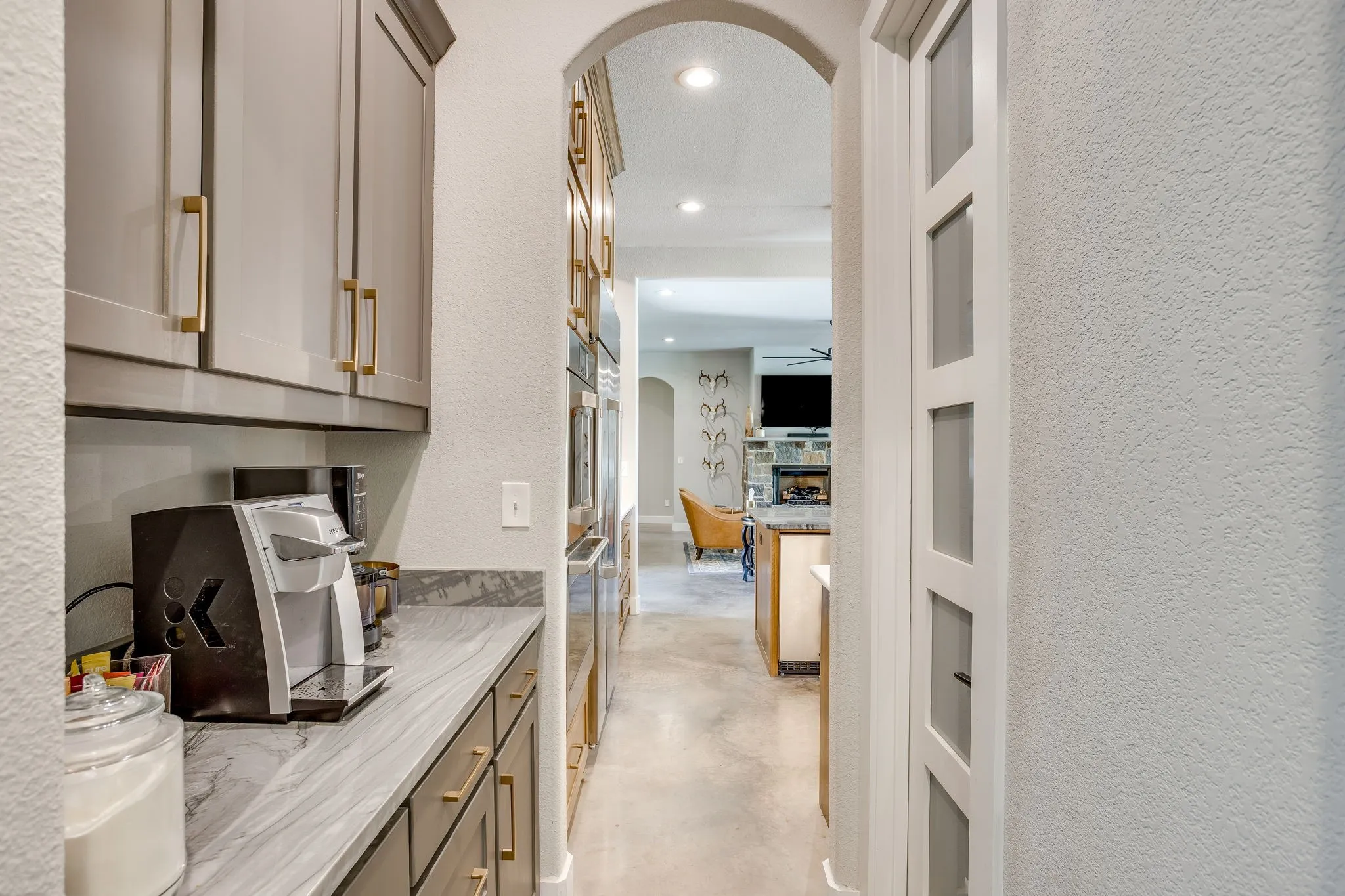 Coffee bar immediately off the kitchen featuring a waterline to connect directly to your coffee maker