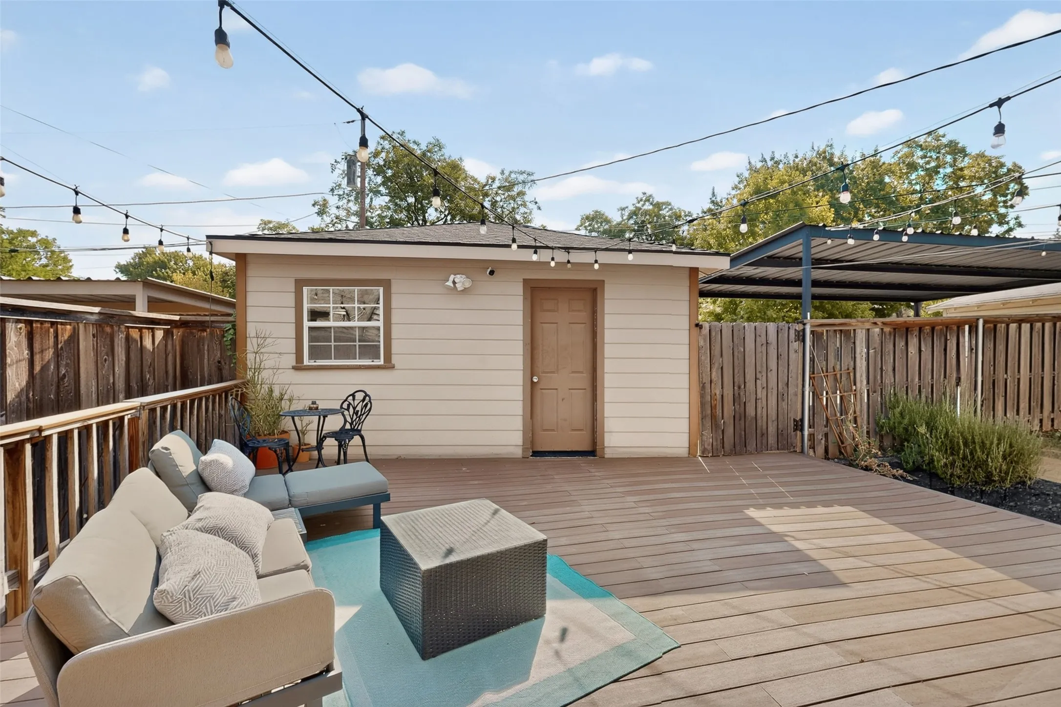 17 x 17 outbuilding behind the deck with electricity and a/c window unit great for storage or could be transformed into a workshop or studio