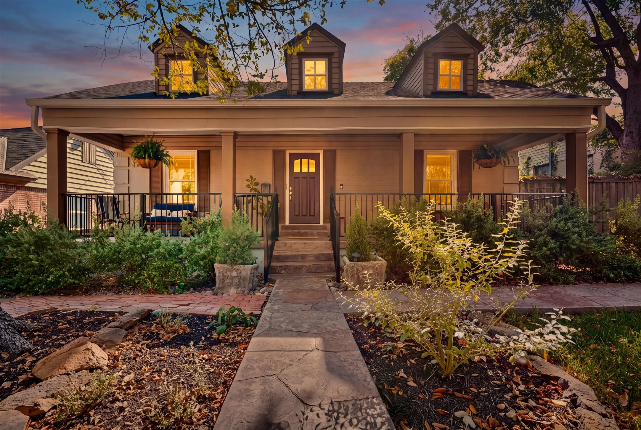 Such a cute facade &  you will enjoy the relaxing shade of the spectacular front elm tree on your full length columned front porch.
