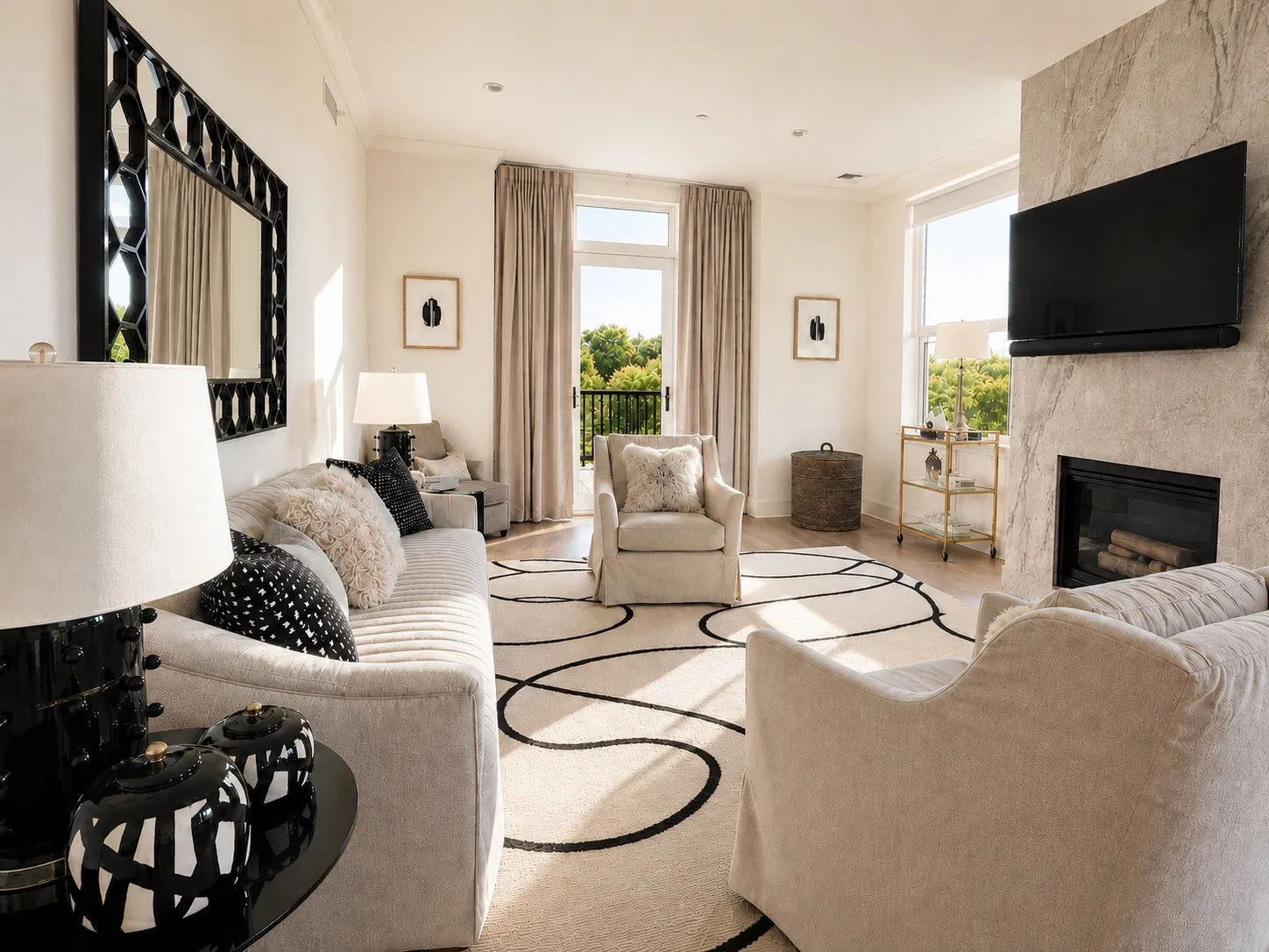 Open concept living room. Gas fireplace with marble surround.