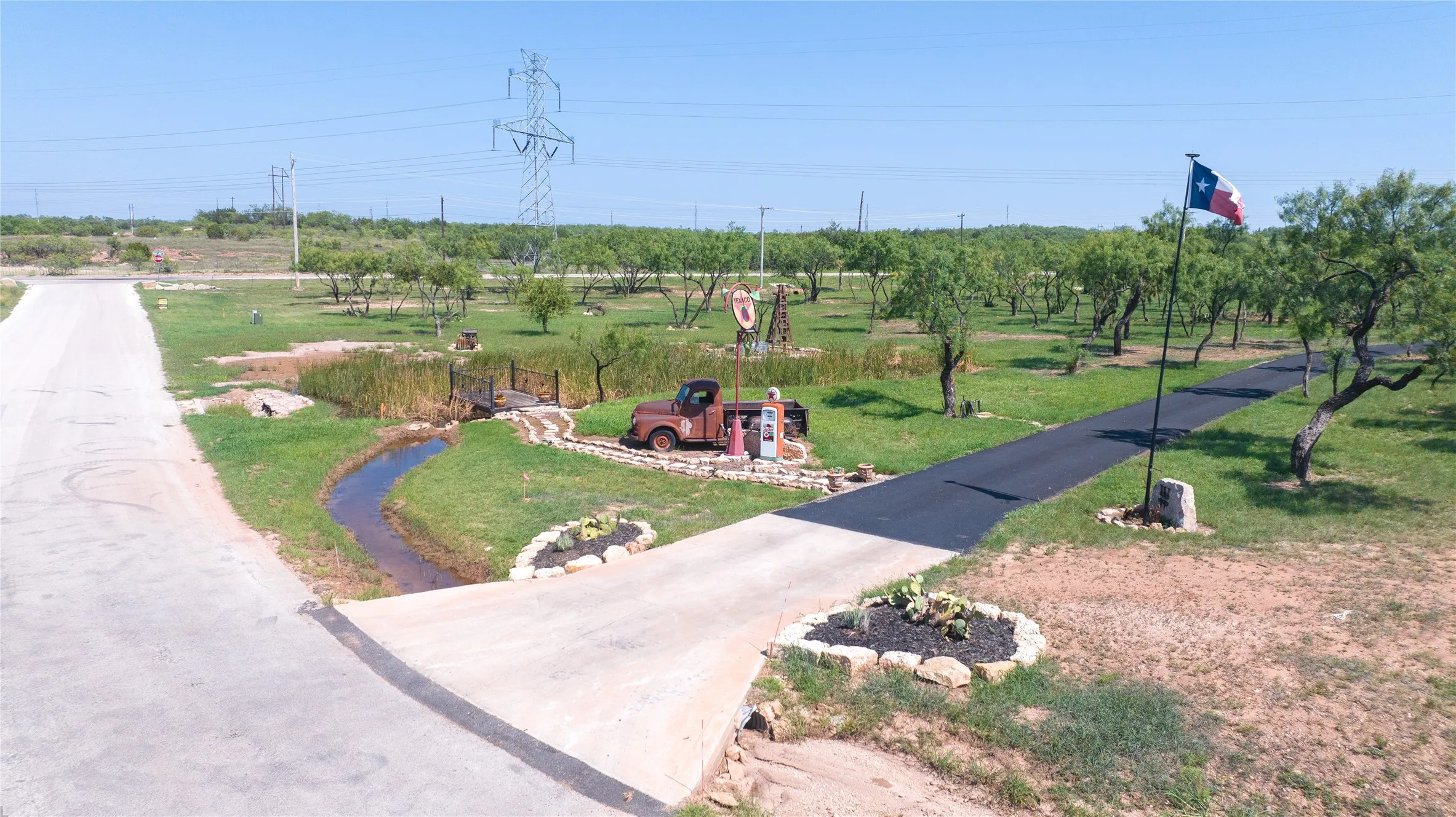 Current owner will remove large equipment upon sale of property. The pond with the observation deck, trail to the pond, and shared driveway access as a permanent easement for the current owner are all included!