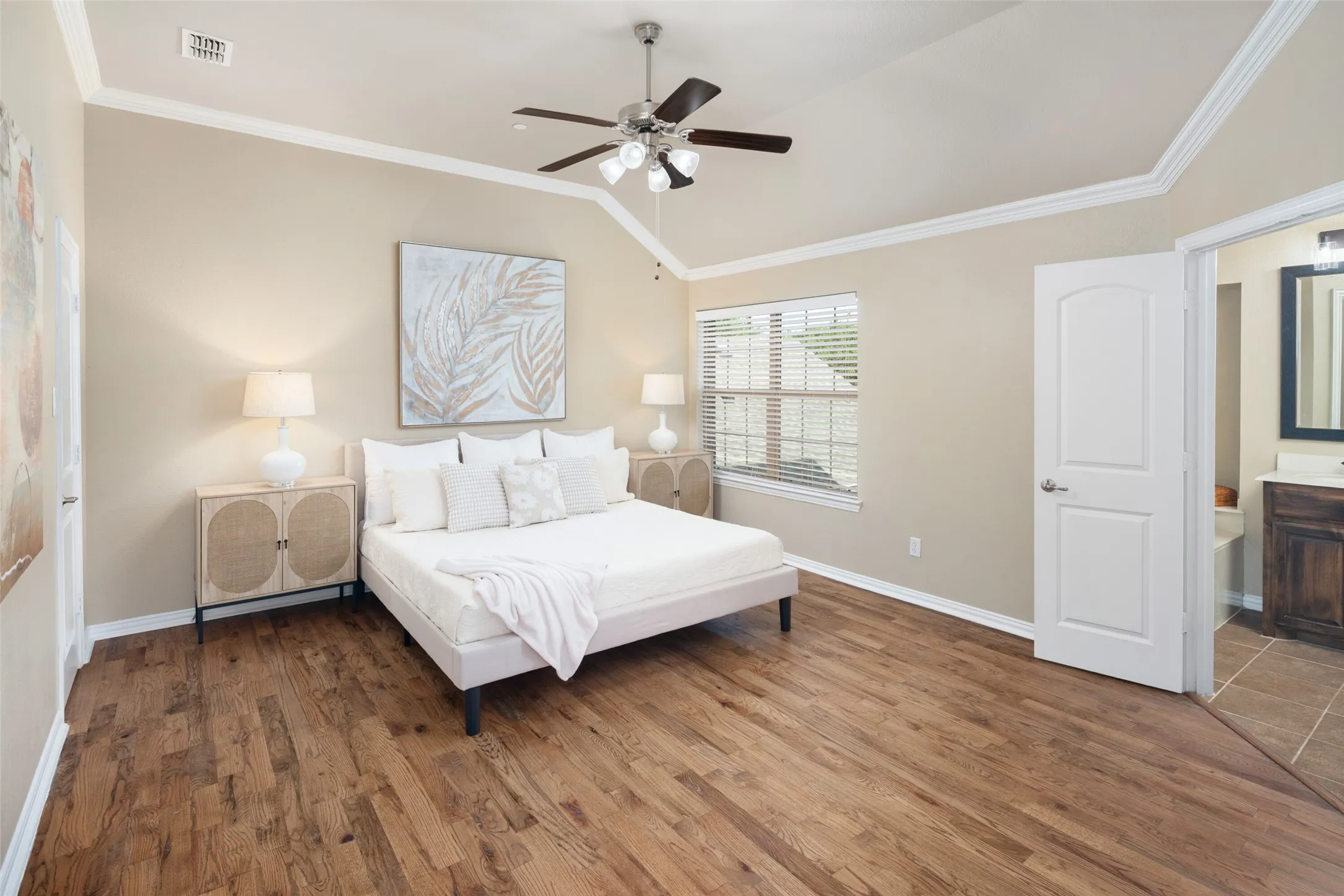 The primary bedroom is spacious with two walk-in closets, one in the bedroom and one in the primary bathroom