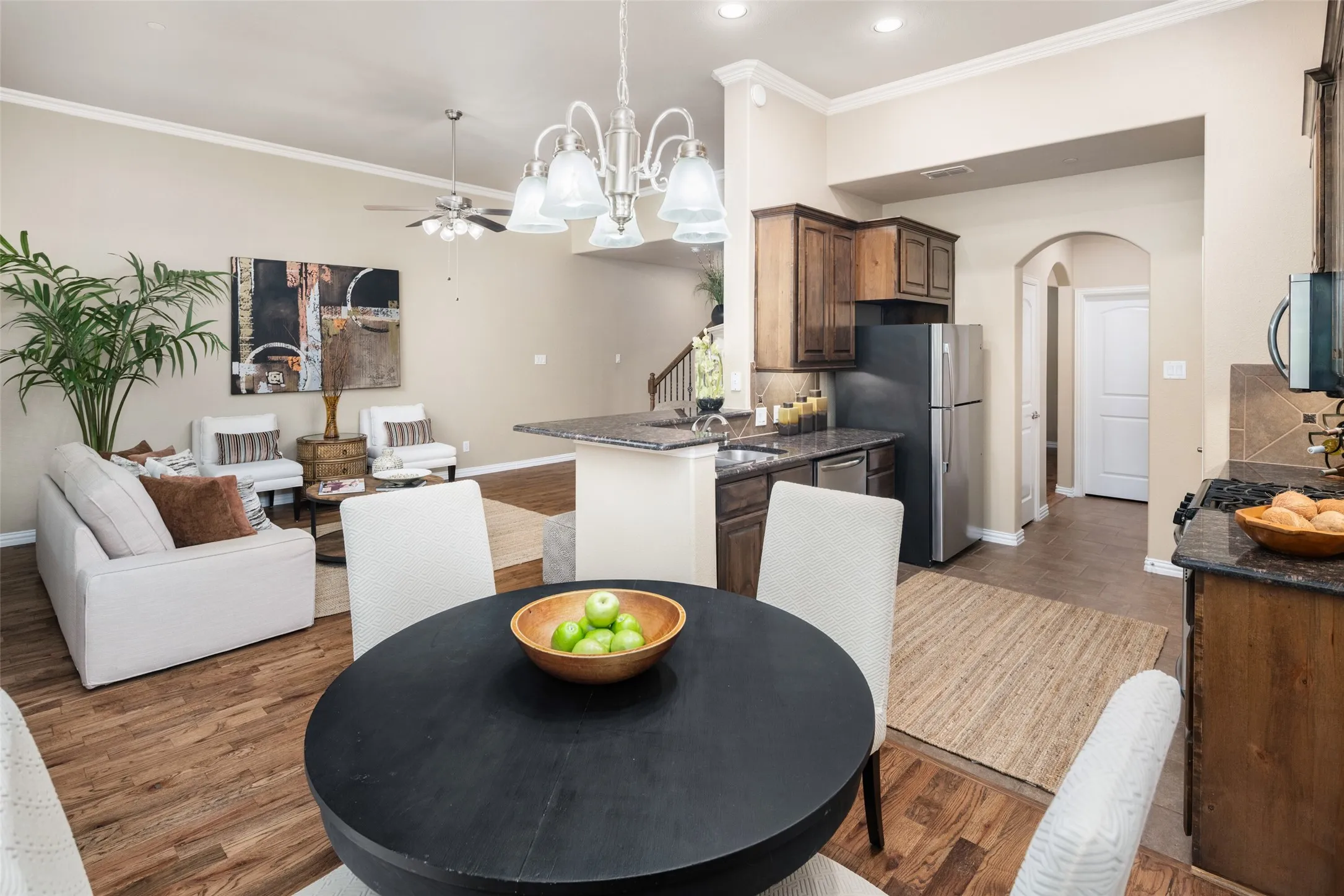Kitchen includes two pantries, stainless steel appliances, 5-burner gas cooktop, refrigerator and a microwave.