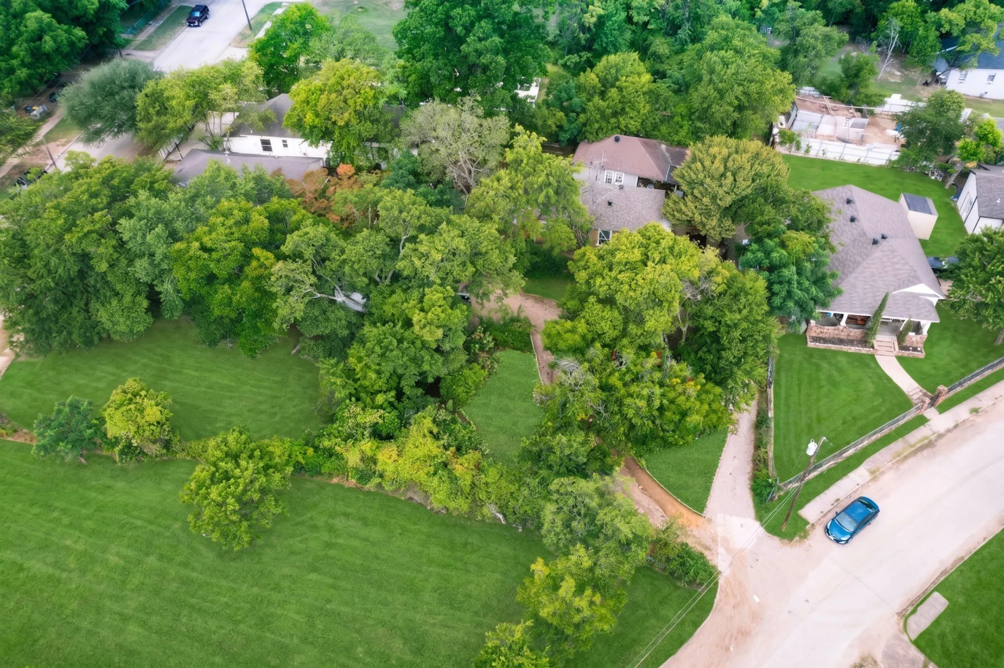 Expansive green lawns with mature trees