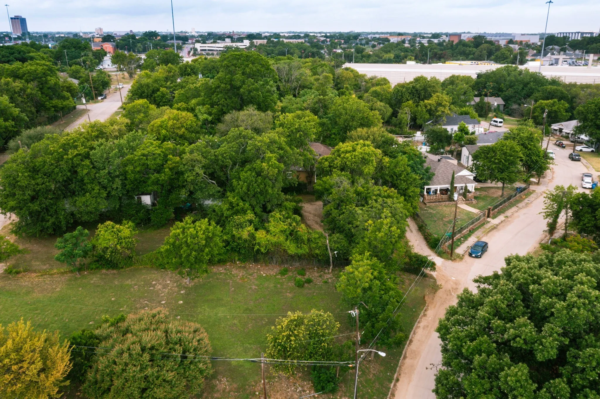 Aerial view of property privately tucked off neighborhood road