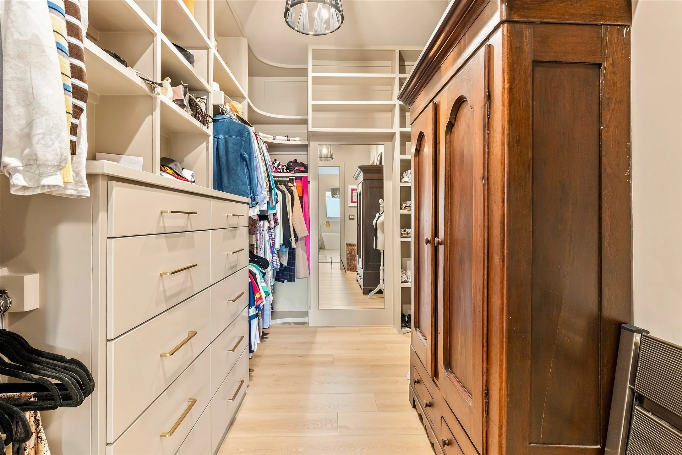 Massive Built-in closet system with open shelving and drawer storage